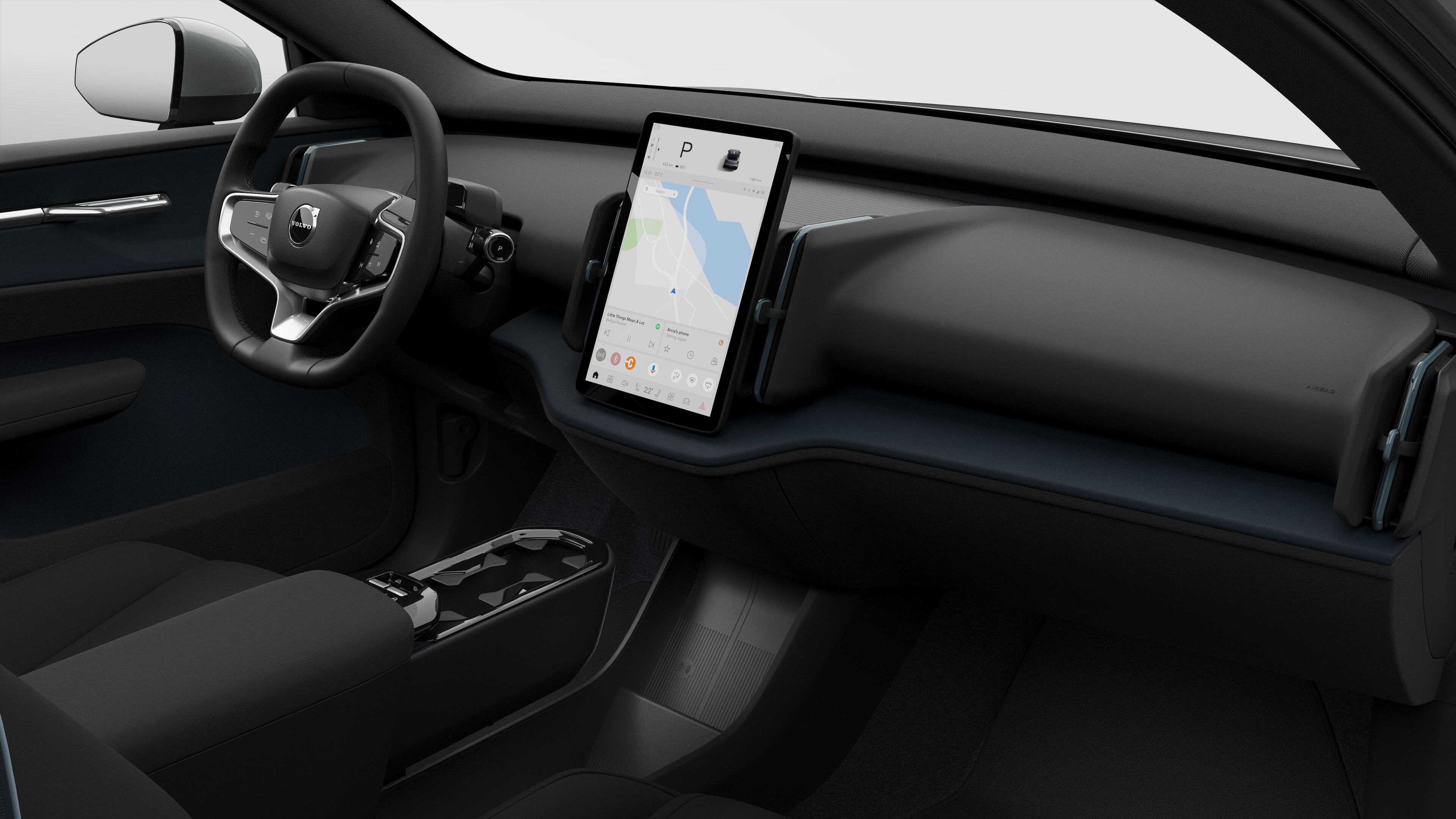 Vista interior de um automóvel Volvo a mostrar o painel de instrumentos, o volante, a consola central e o ecrã digital num fundo de estúdio simples.
