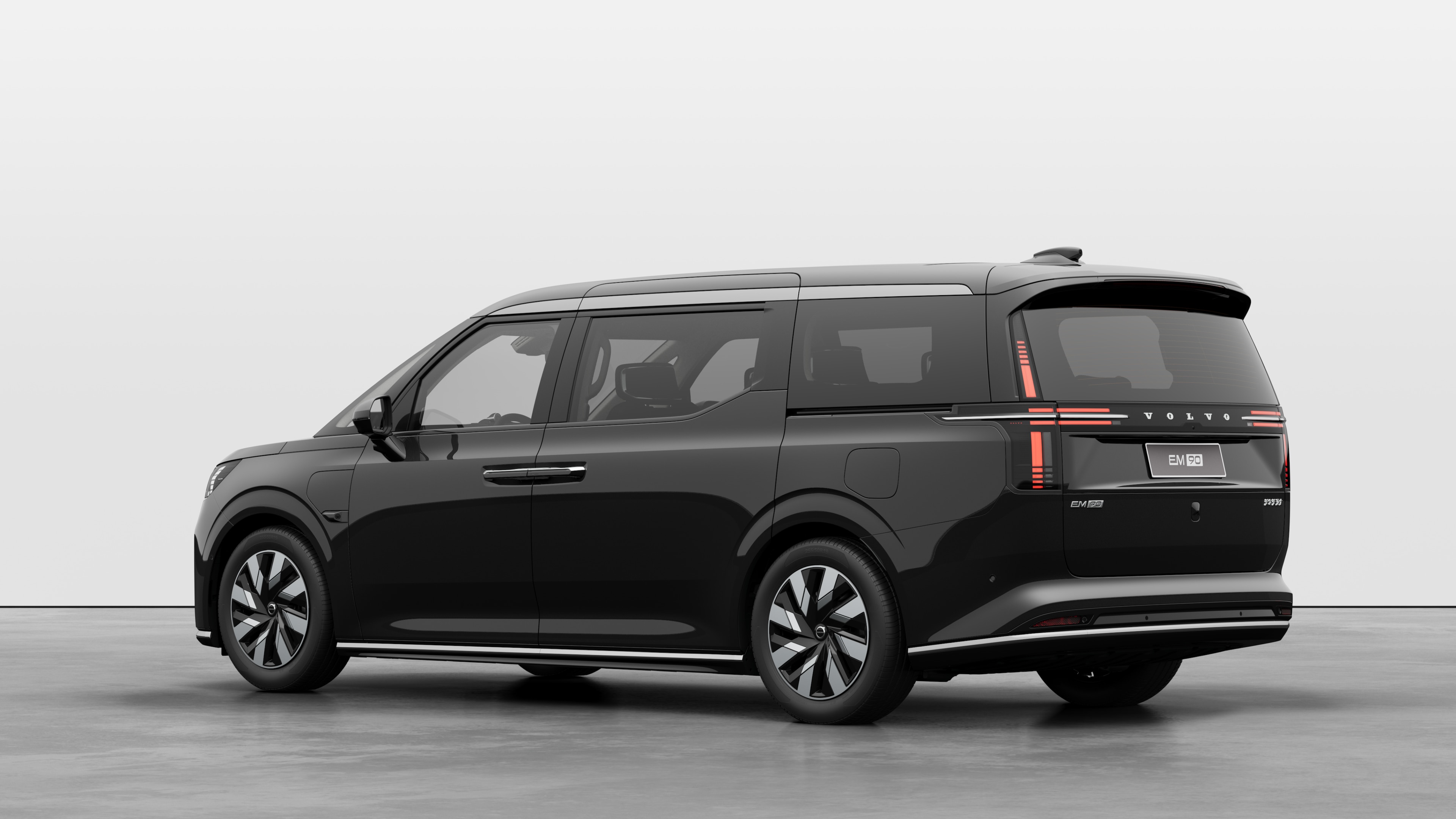 Volvo car rear three-quarter view in a plain studio background.