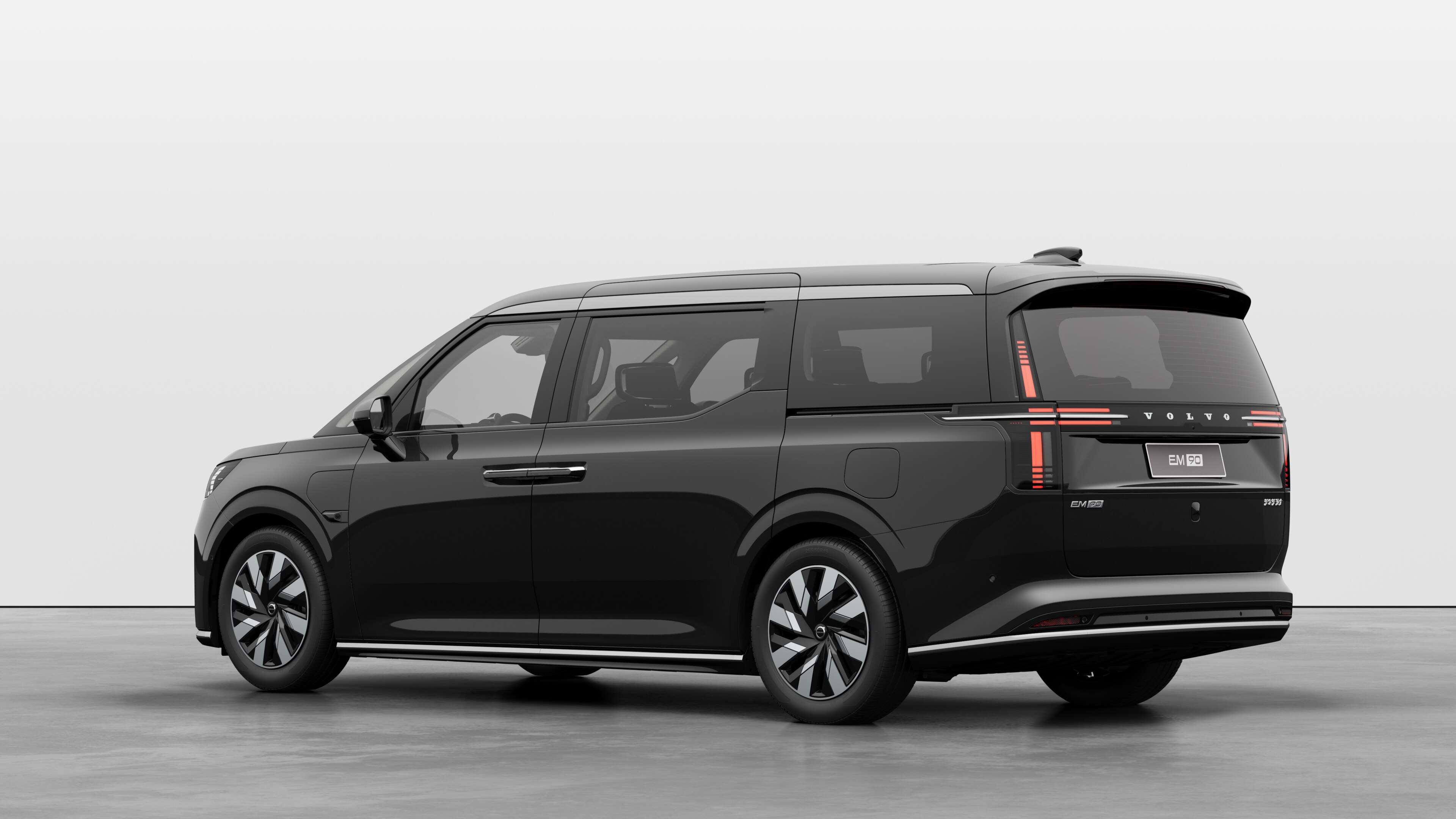 Volvo car rear three-quarter view in a plain studio background.