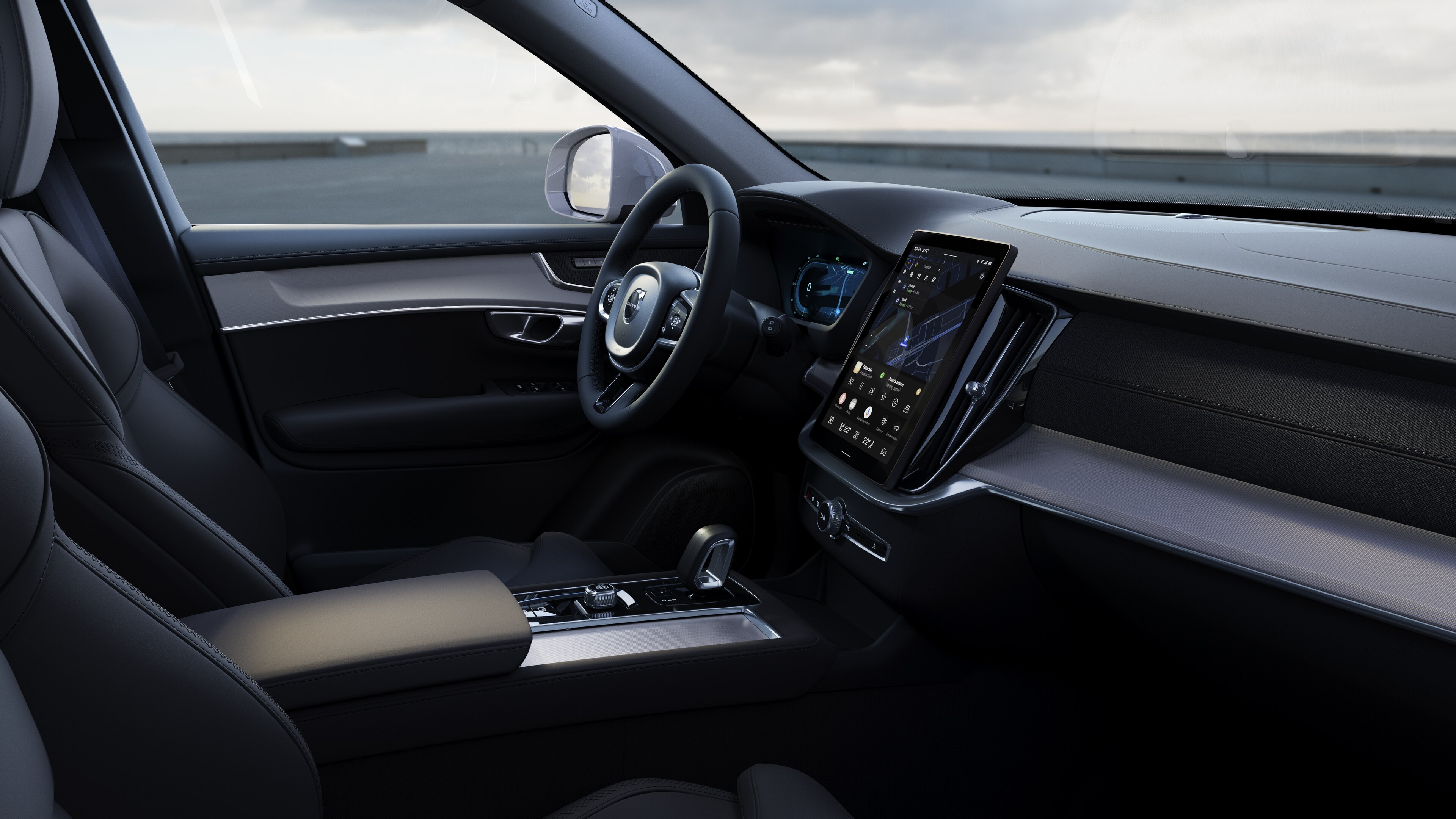 Volvo car interior showing dashboard, steering wheel, and center console with digital display in an open road background.