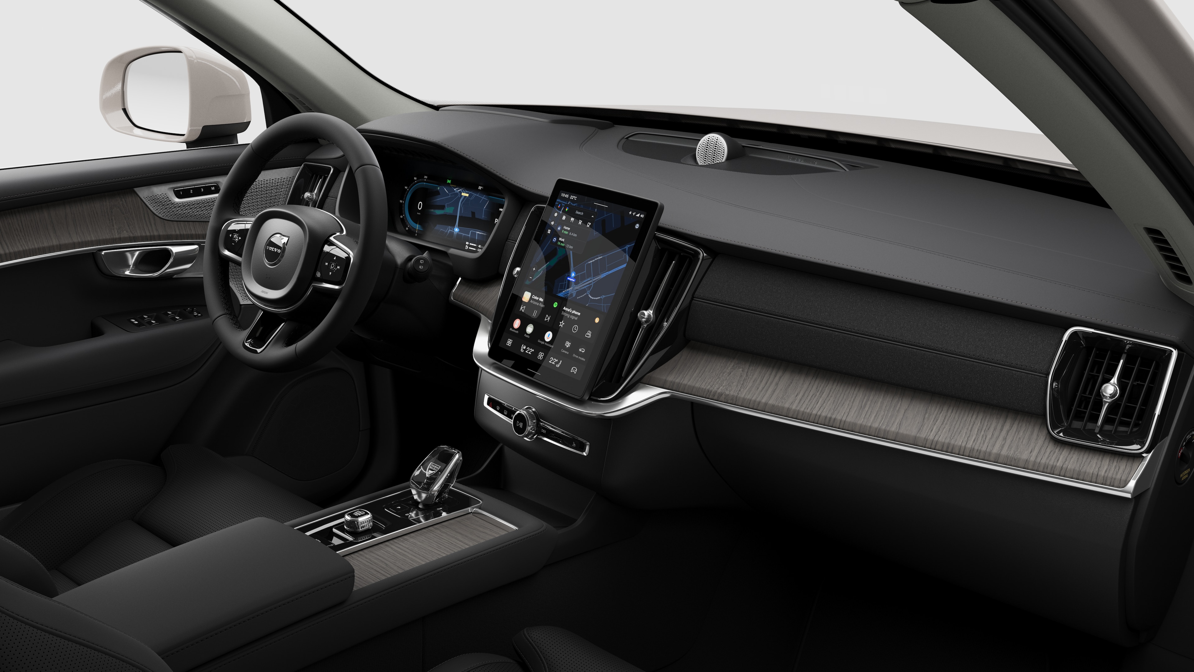 Volvo 汽車的內部視圖，以純色工作室背景顯示儀錶板、方向盤、中控台和數字顯示幕。