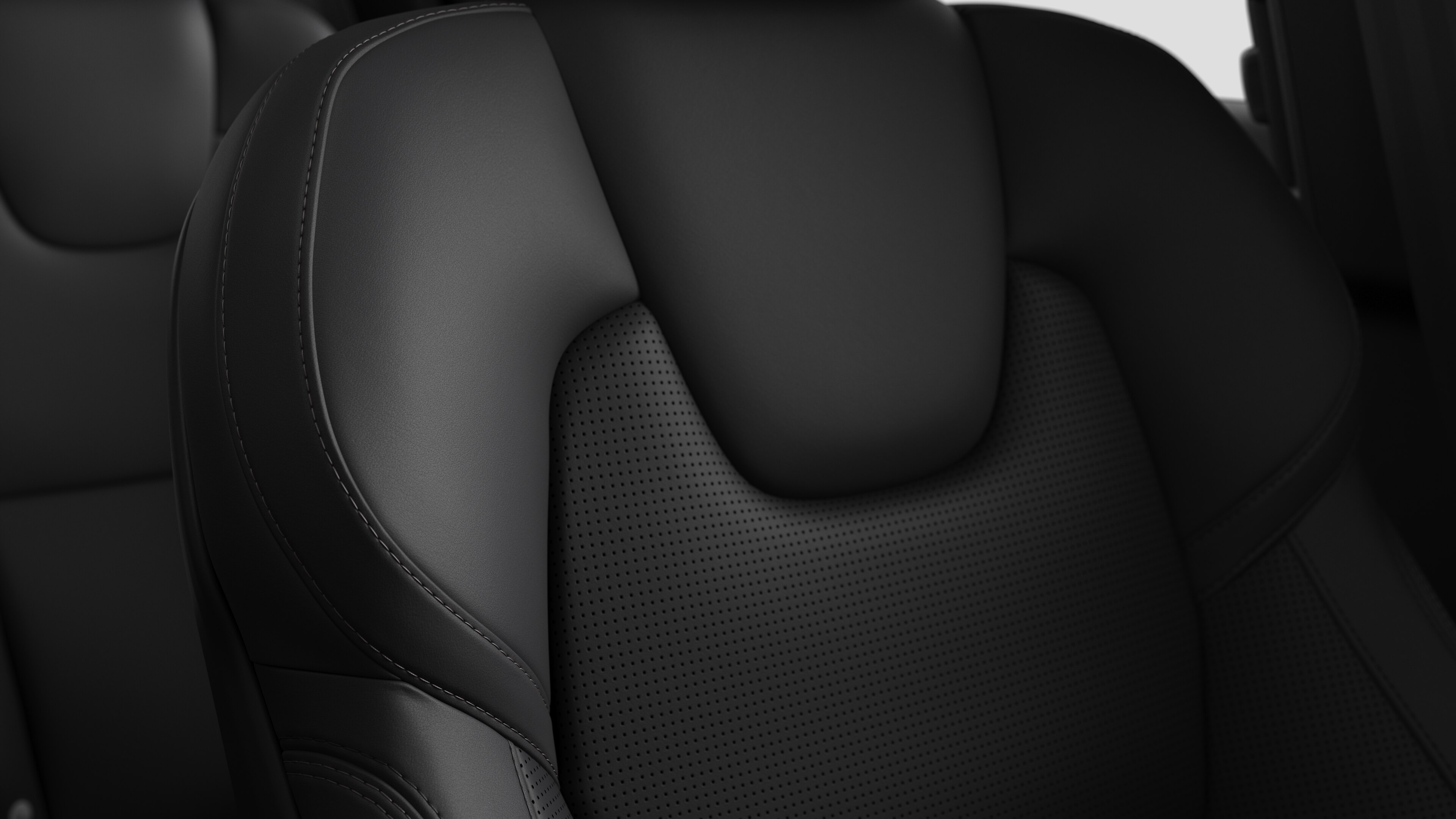 Close-up of Volvo car interior seat detail showing stitching and a small Swedish flag tag.