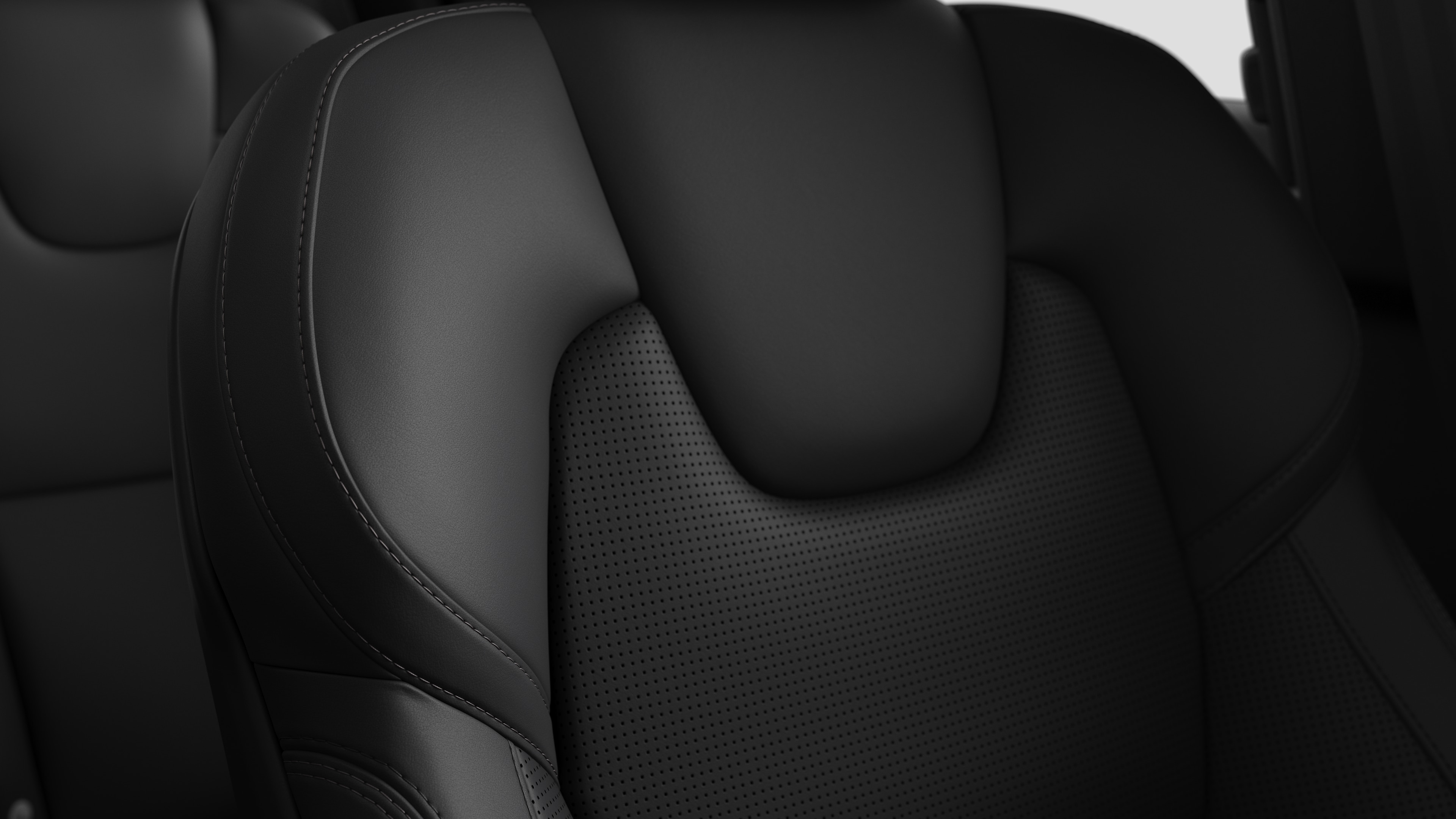 Close-up of Volvo car interior seat detail showing stitching and a small Swedish flag tag.