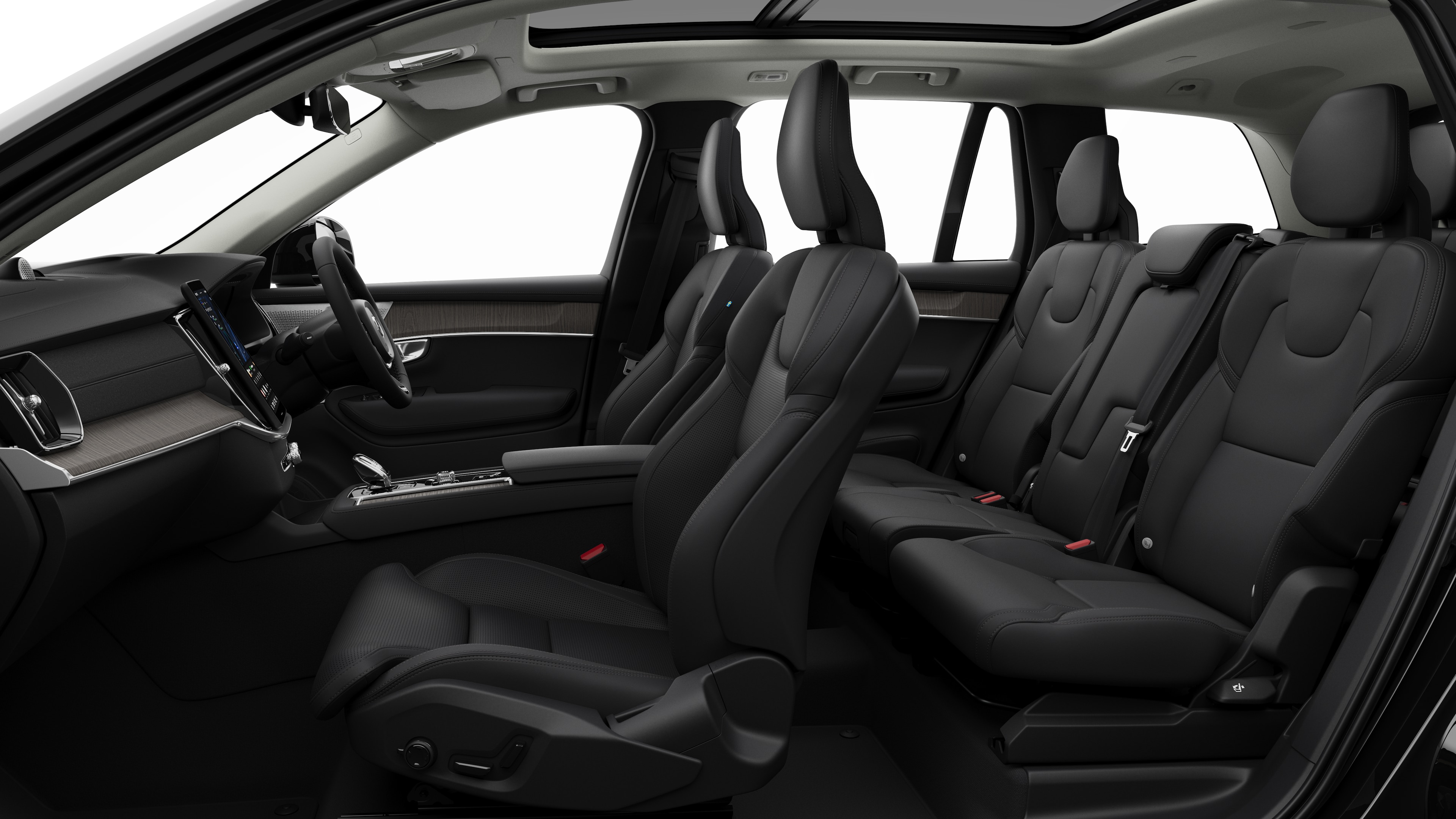 Volvo car interior side view showcasing front seats, rear passenger seats, steering wheel, dashboard, and center console, set against plain studio background.