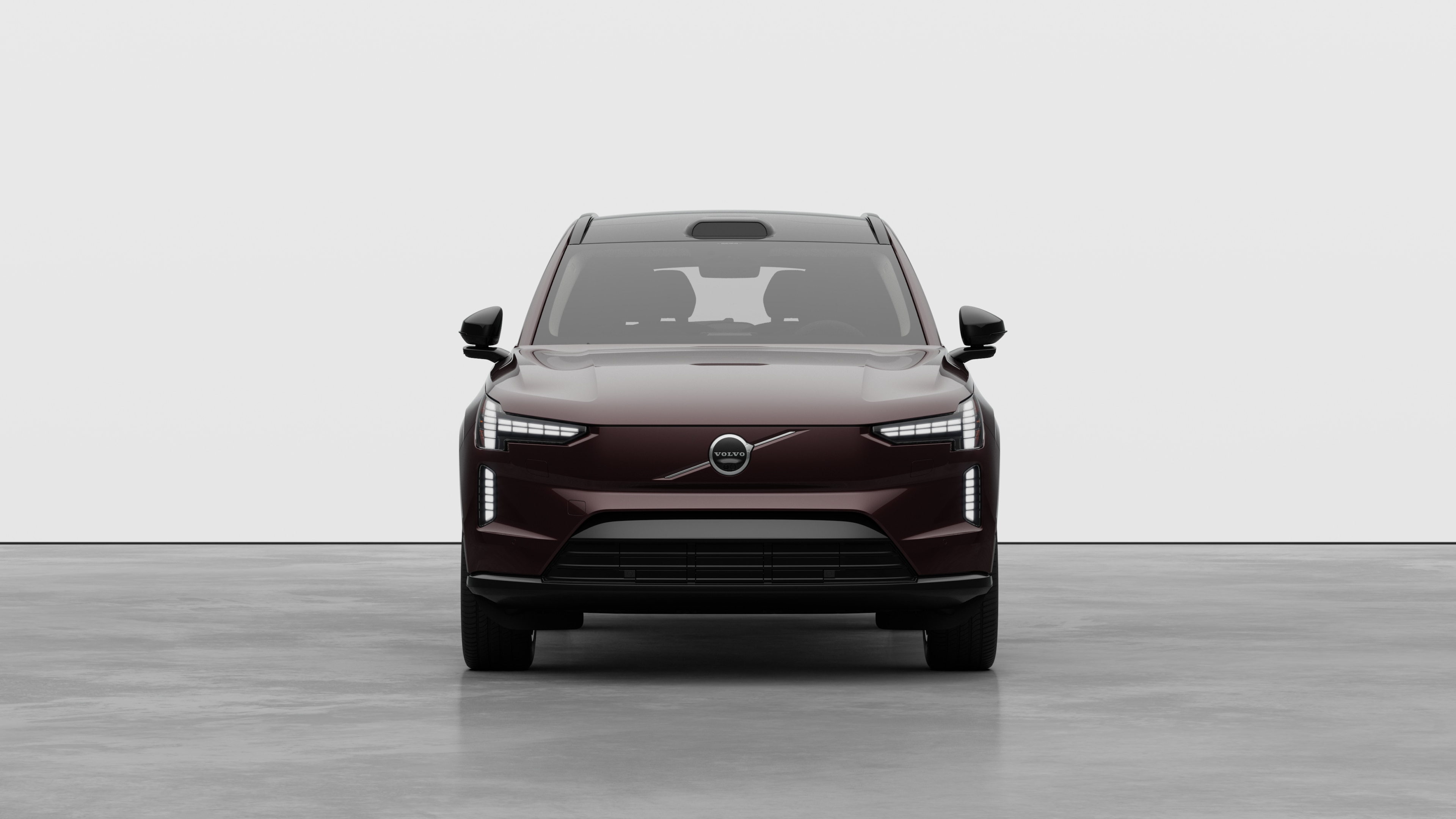 Front view of a Volvo car in a plain studio background.