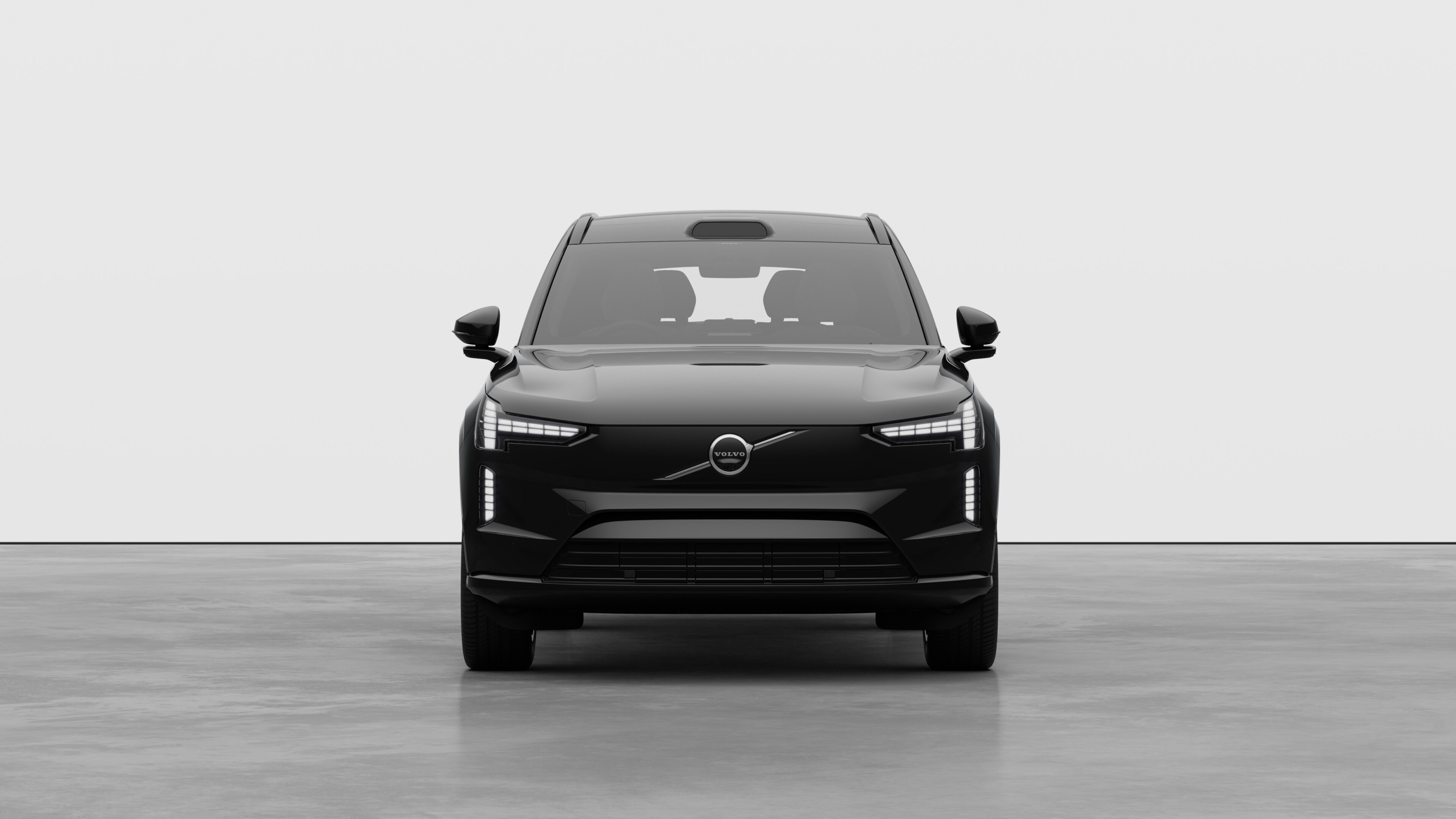 Front view of a Volvo car in a plain studio background.