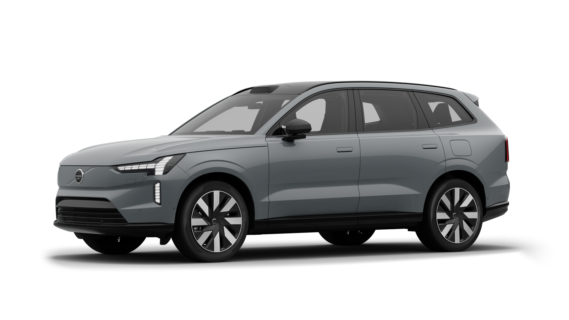 Volvo-bíll að utan í þriggja fjórðu hluta myndversins í bakgrunni.