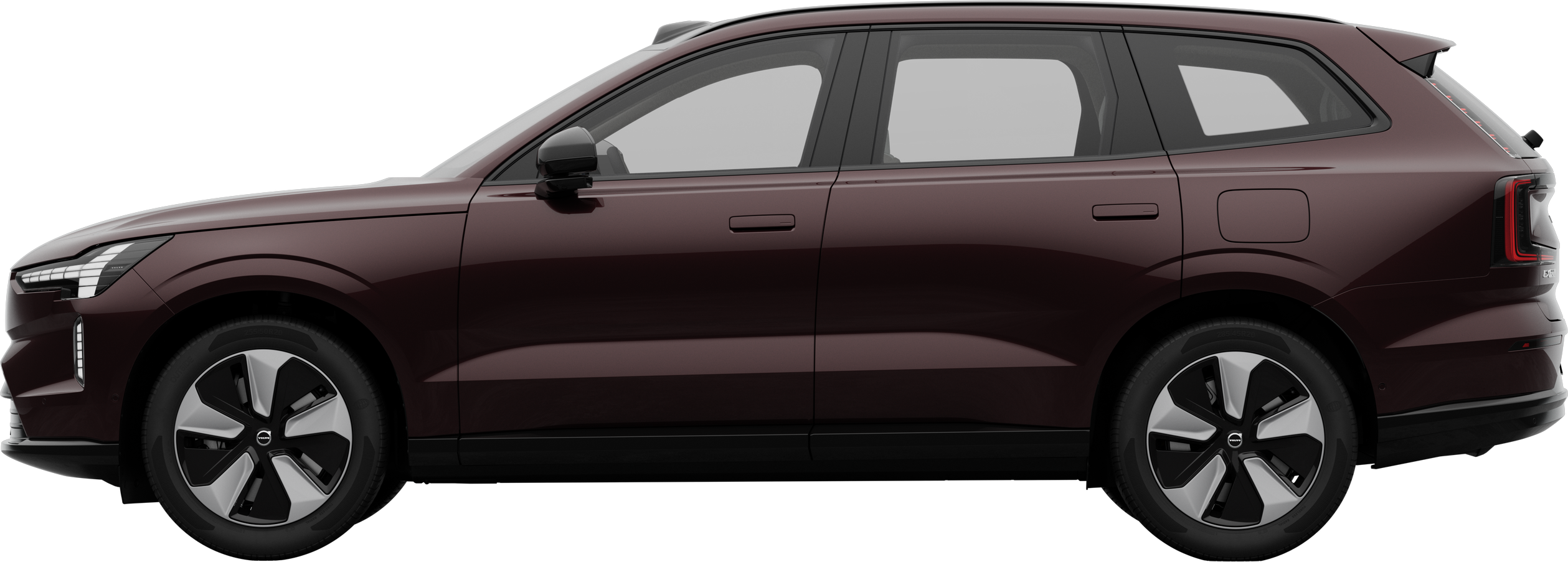 Vue latérale d’une Volvo garée sur un fond de studio uni, mettant en valeur le profil et le design épurés du véhicule.