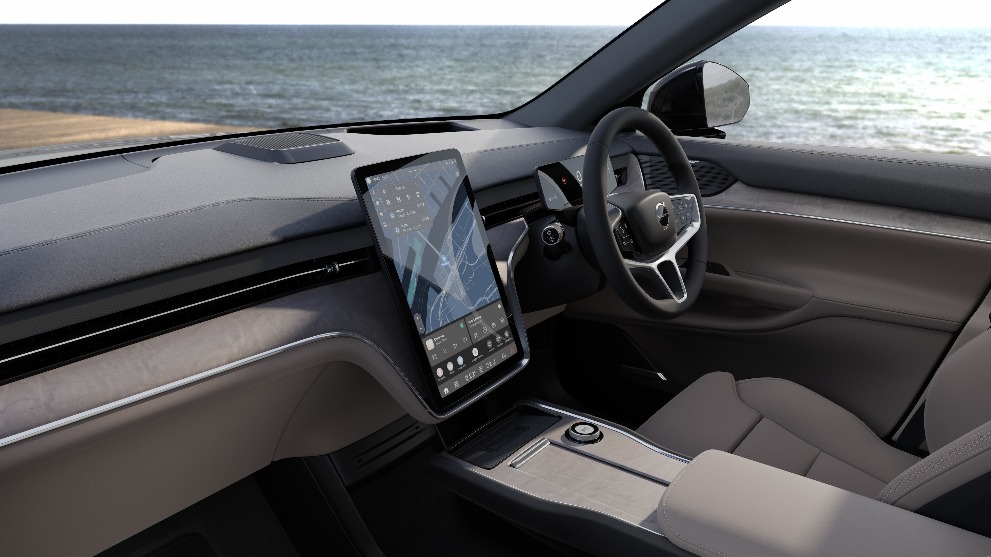 Volvo car interior showing dashboard, steering wheel, and center console with digital display in an open road background.
