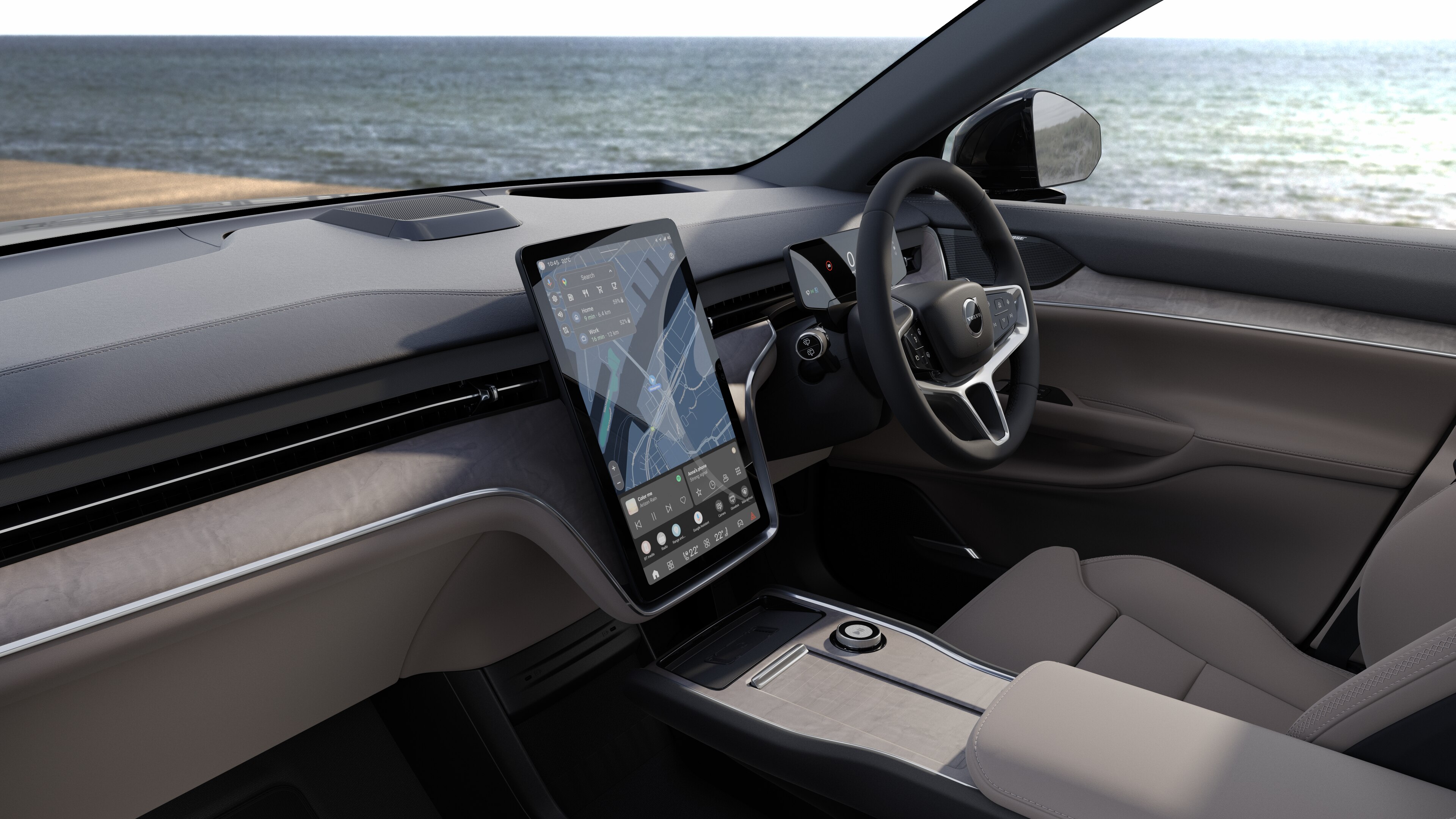 Volvo car interior showing dashboard, steering wheel, and center console with digital display in an open road background.