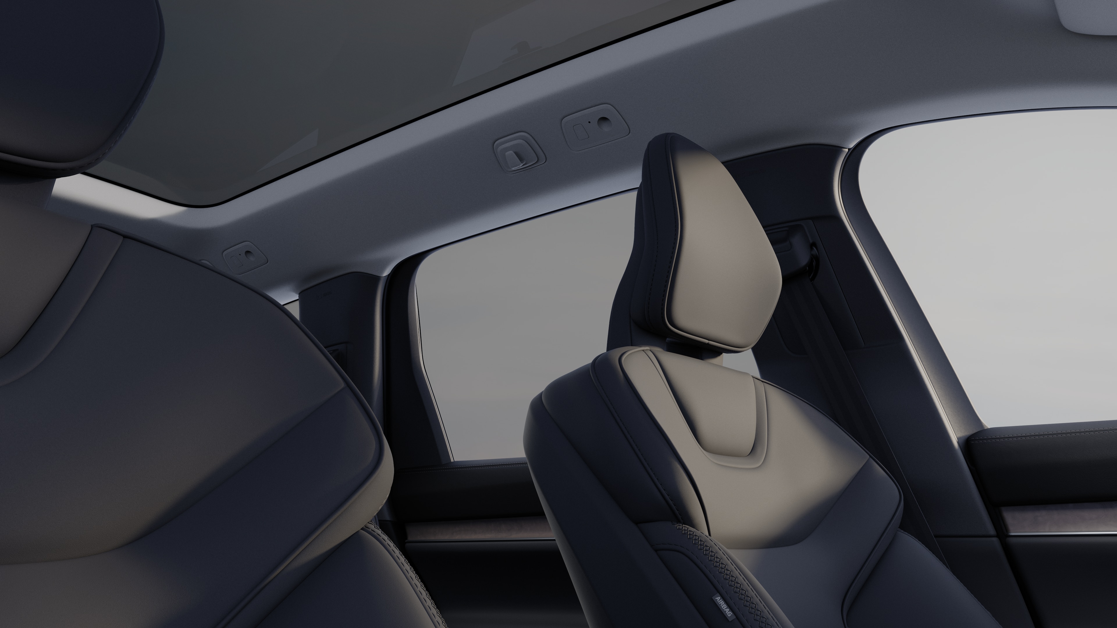 Interior del vehículo Volvo que muestra los asientos delanteros y traseros de los pasajeros, el volante, el salpicadero y la consola central sobre un fondo de estudio liso.