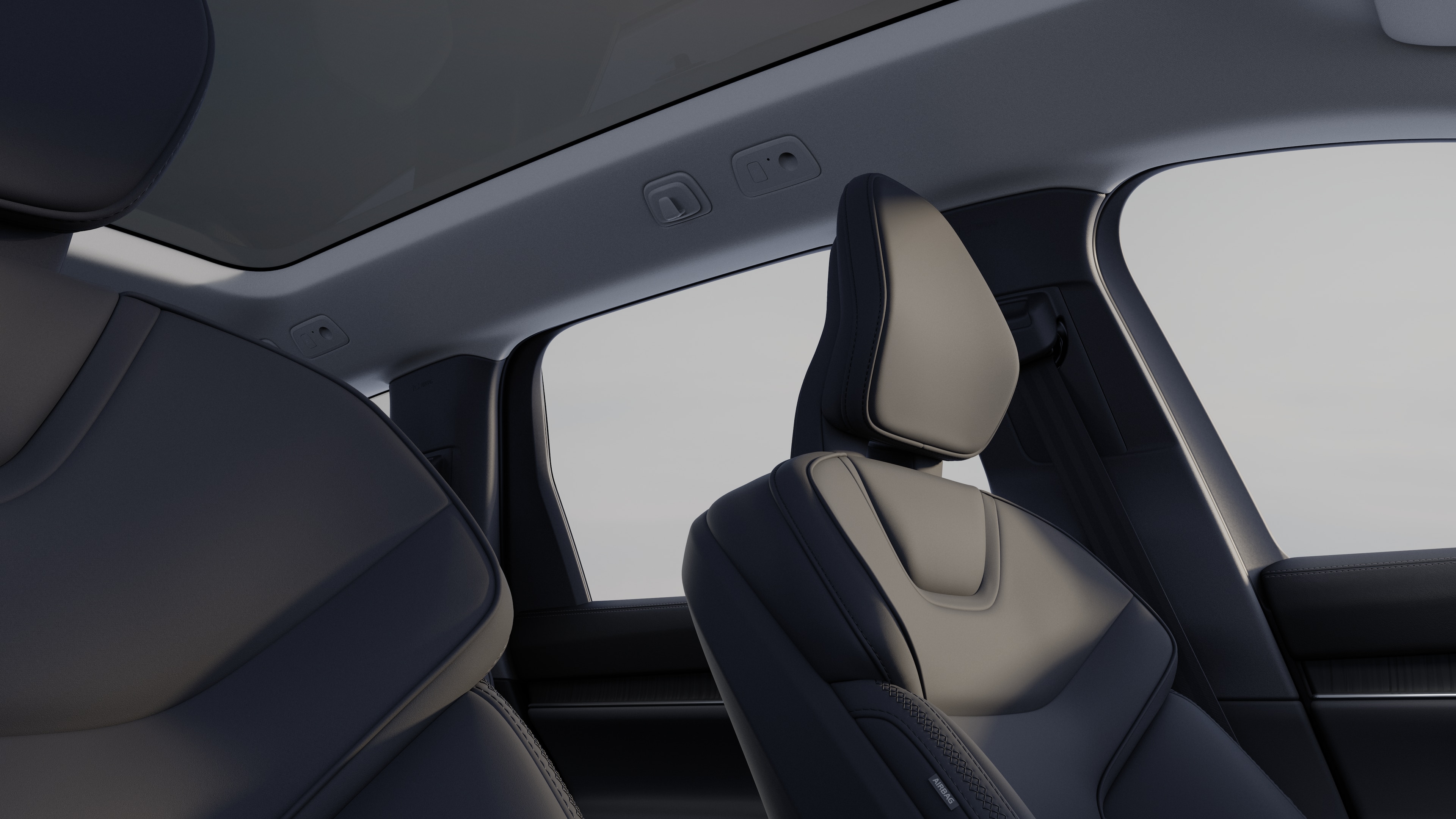 Intérieur d’une Volvo montrant les sièges passagers avant et arrière, le volant, le tableau de bord et la console centrale sur un fond de studio uni.