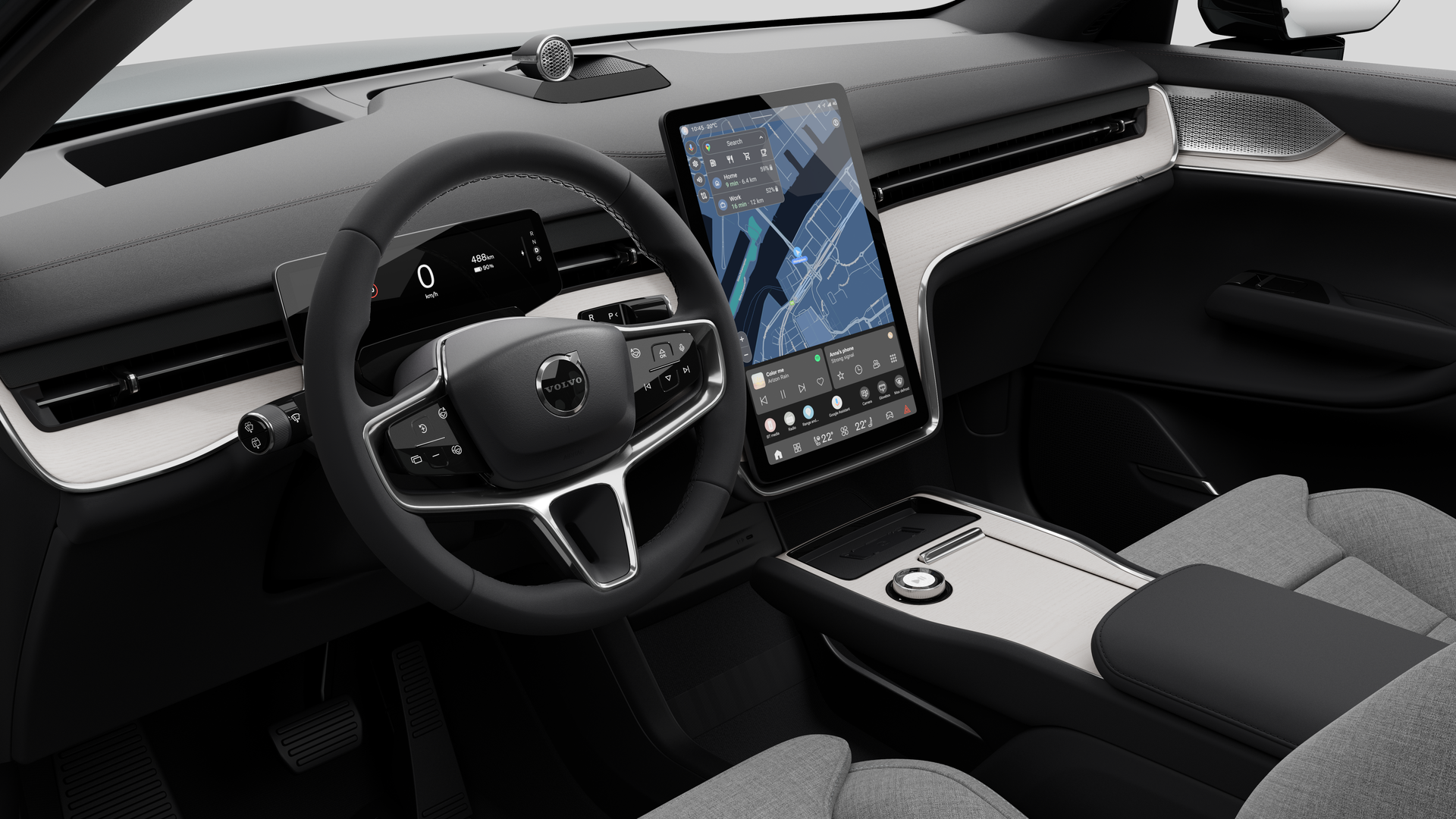 Vue intérieure d’une Volvo montrant le tableau de bord, le volant, la console centrale et l’écran d’affichage numérique sur un fond de studio uni.