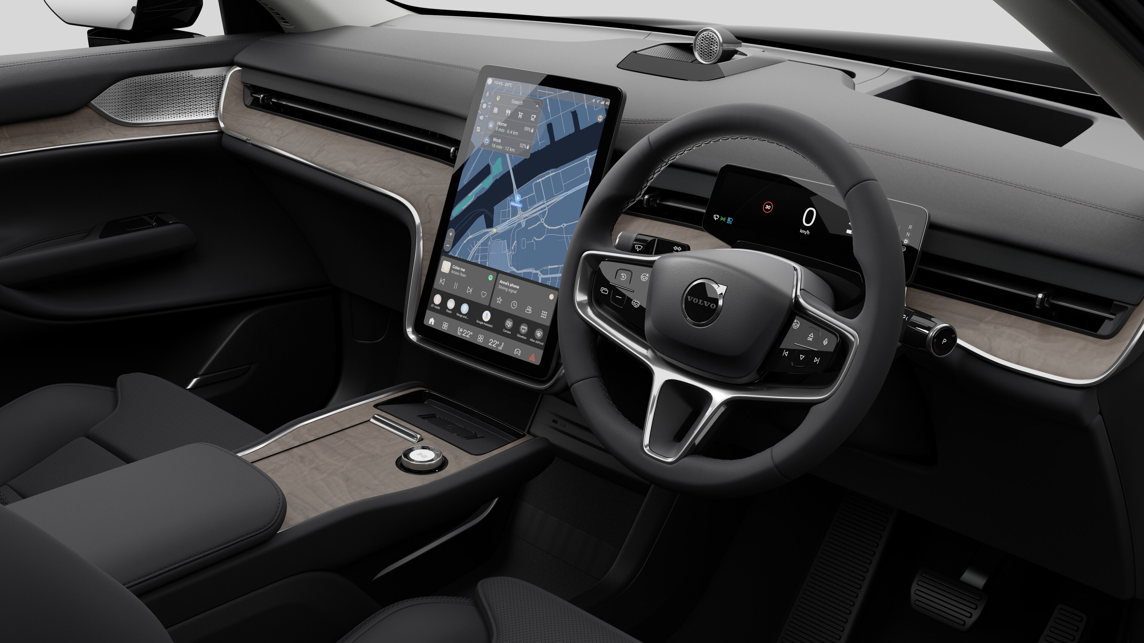 Interior view of a Volvo car showing the dashboard, steering wheel, center console, and digital display screen in a plain studio background.