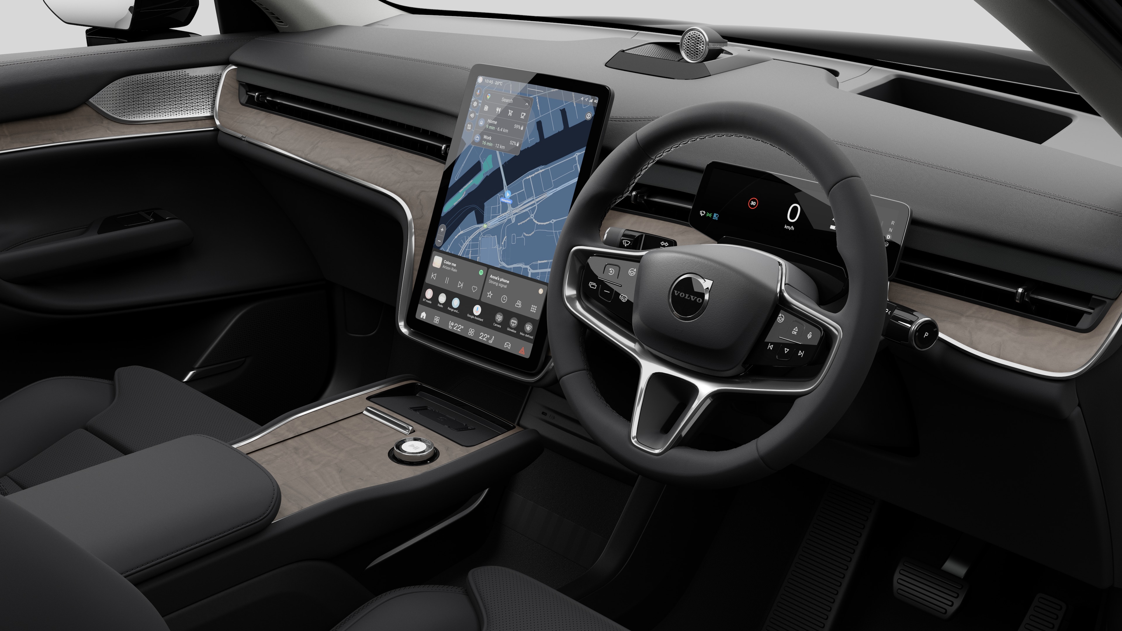 Interior view of a Volvo car showing the dashboard, steering wheel, center console, and digital display screen in a plain studio background.