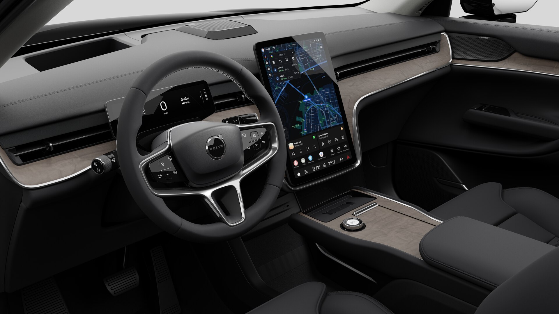 Vista interior de un vehículo Volvo que muestra el salpicadero, el volante, la consola central y la pantalla de visualización digital en un fondo de estudio liso.