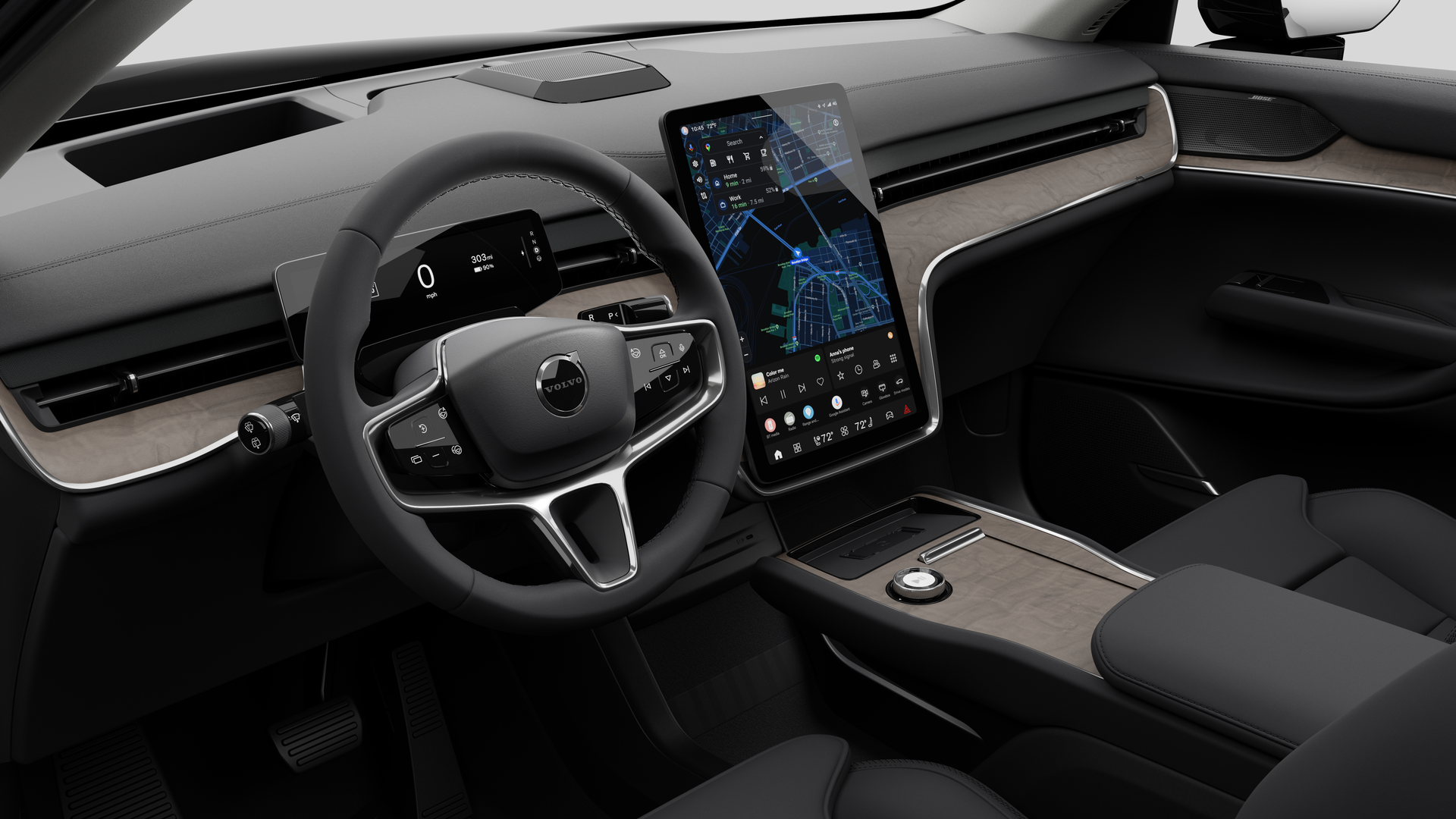 Vista interior de un vehículo Volvo que muestra el salpicadero, el volante, la consola central y la pantalla de visualización digital en un fondo de estudio liso.