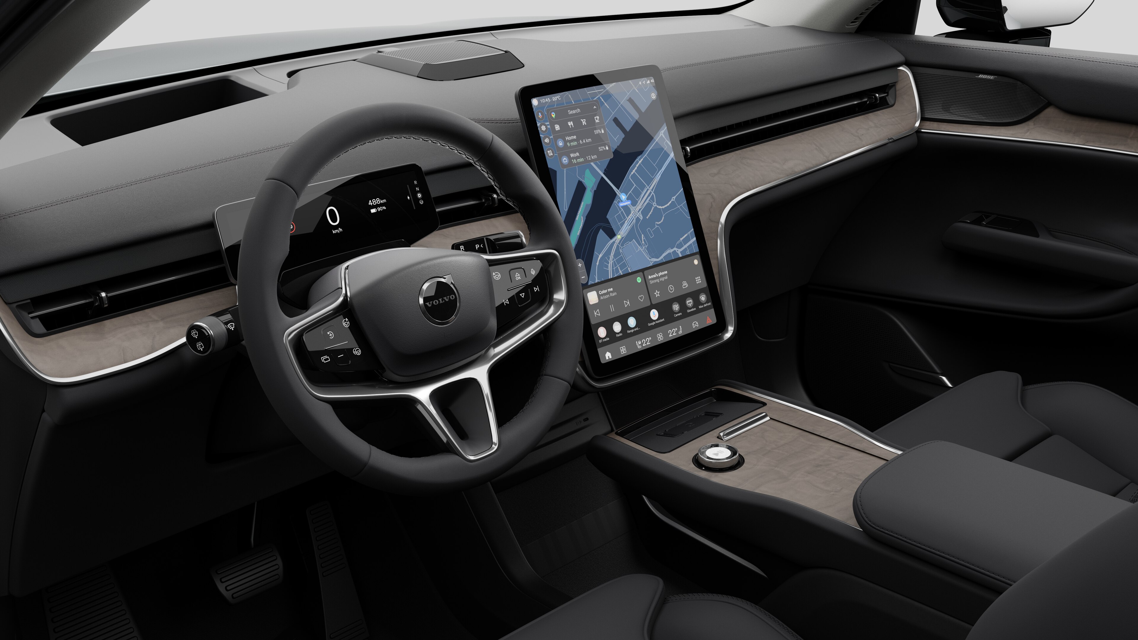 Vista interior de un vehículo Volvo que muestra el salpicadero, el volante, la consola central y la pantalla de visualización digital en un fondo de estudio liso.