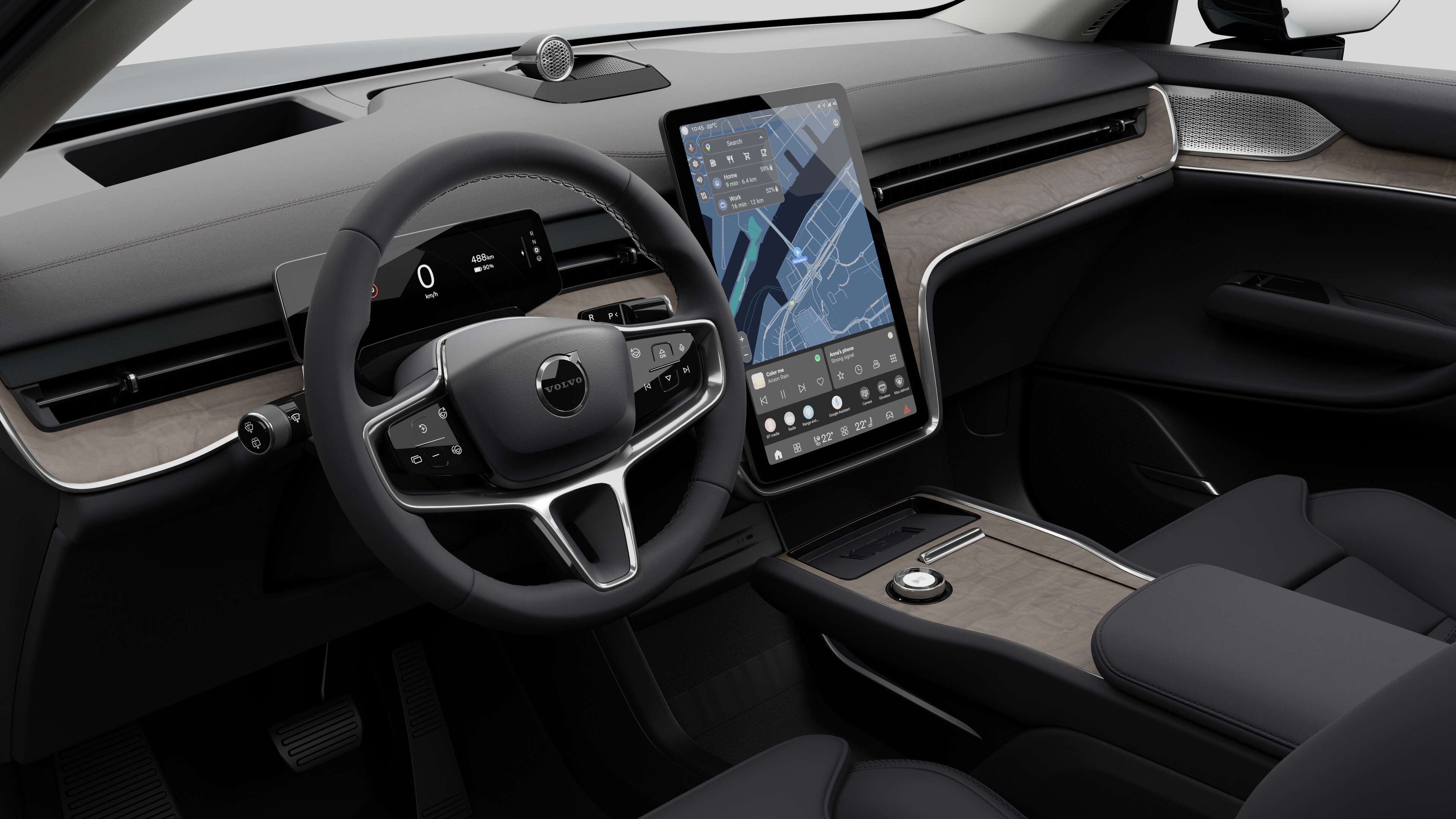 Vista interior de un vehículo Volvo que muestra el salpicadero, el volante, la consola central y la pantalla de visualización digital en un fondo de estudio liso.