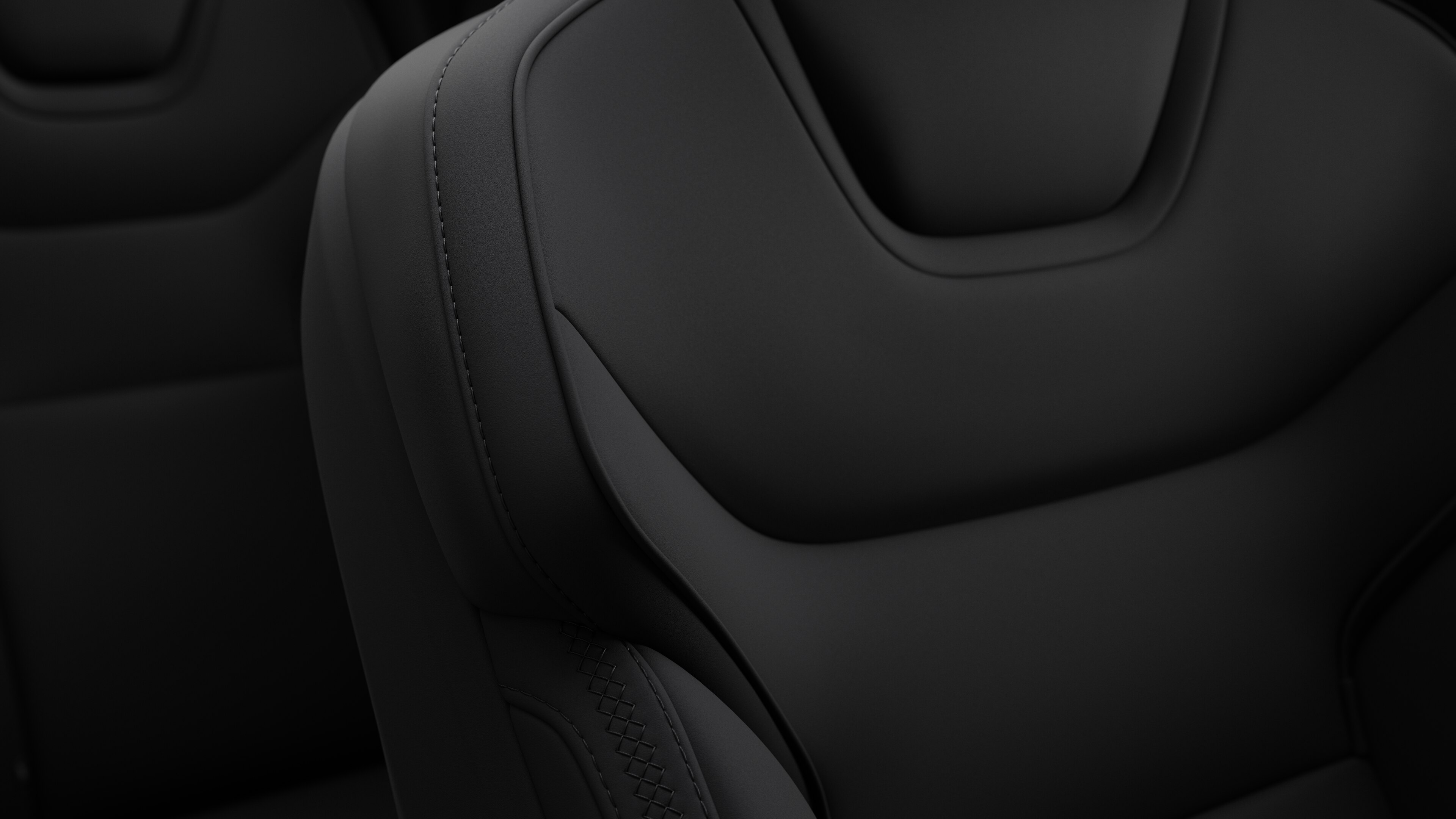 Close-up of Volvo car interior seat detail showing stitching and a small Swedish flag tag.