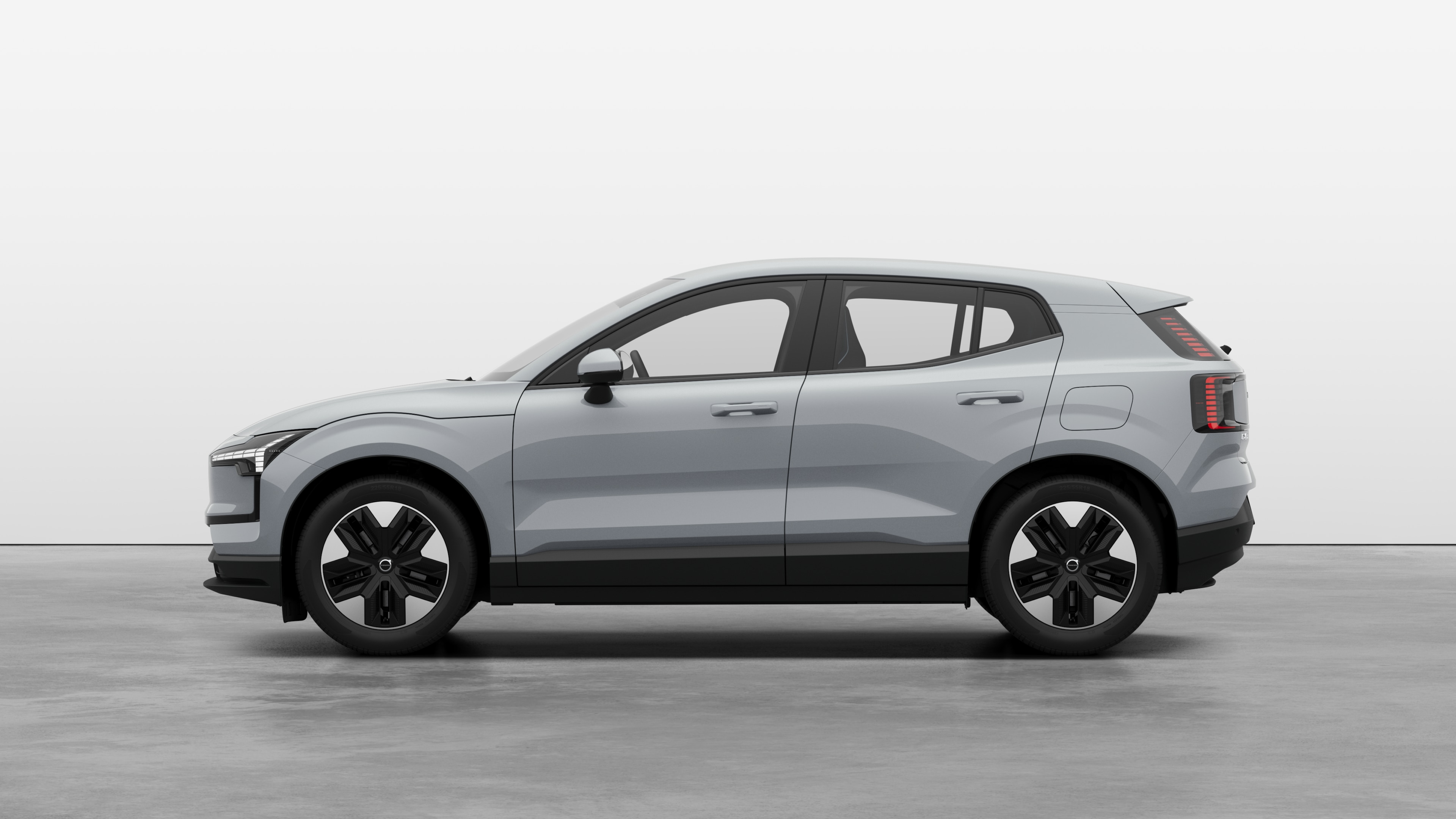 Carro Volvo com vista lateral contra um fundo de estúdio simples. Não há detalhes ou identificadores adicionais.