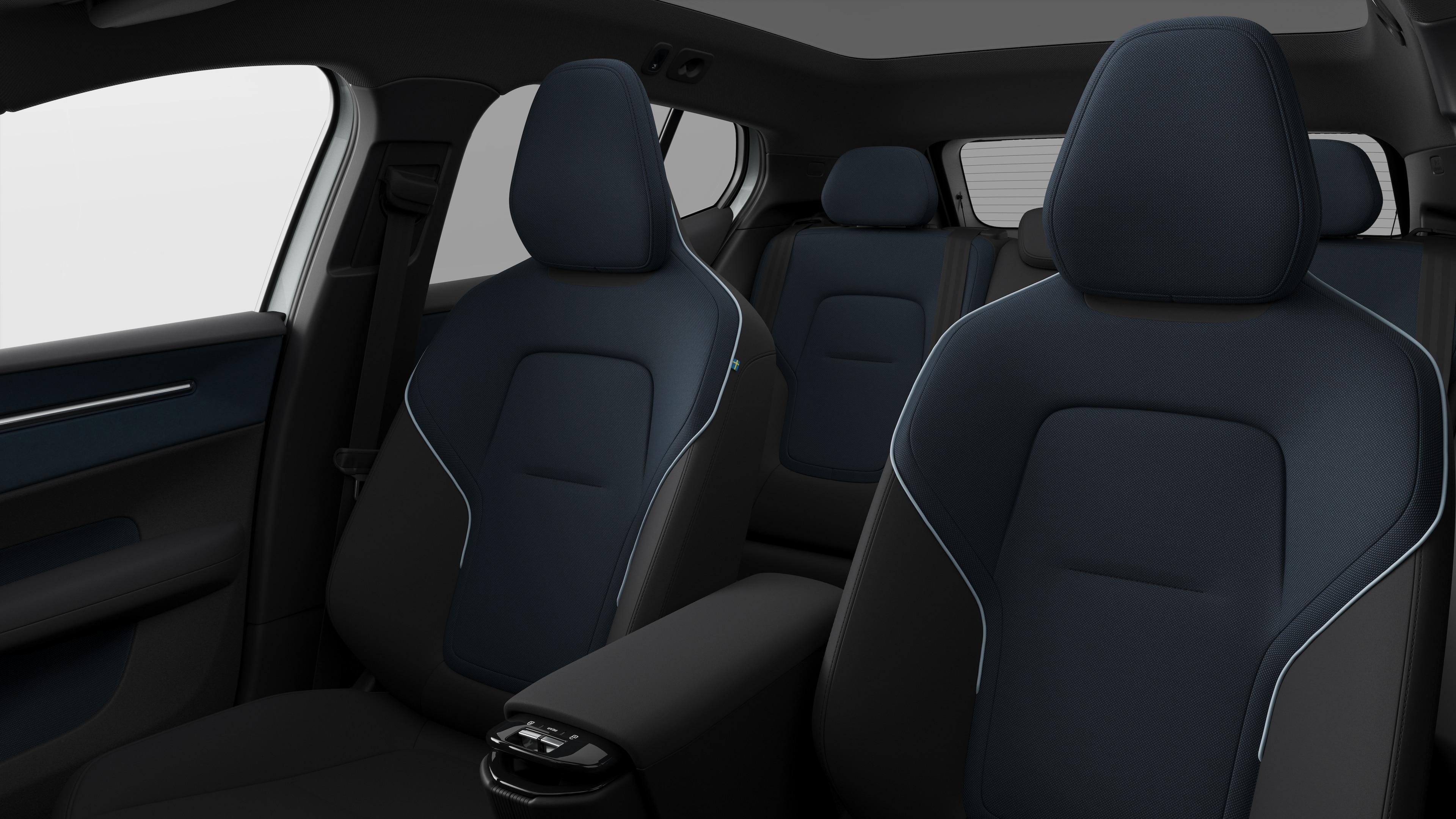 Volvo car interior showing rear passenger seats and center console in plain studio background.