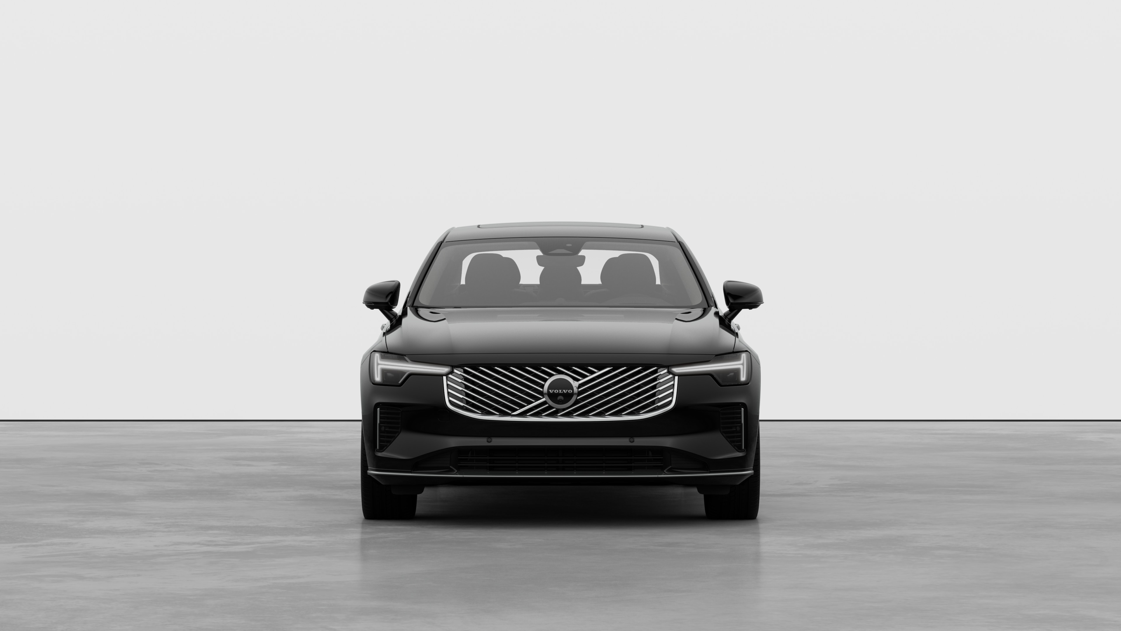 Front view of a Volvo car in a plain studio background.