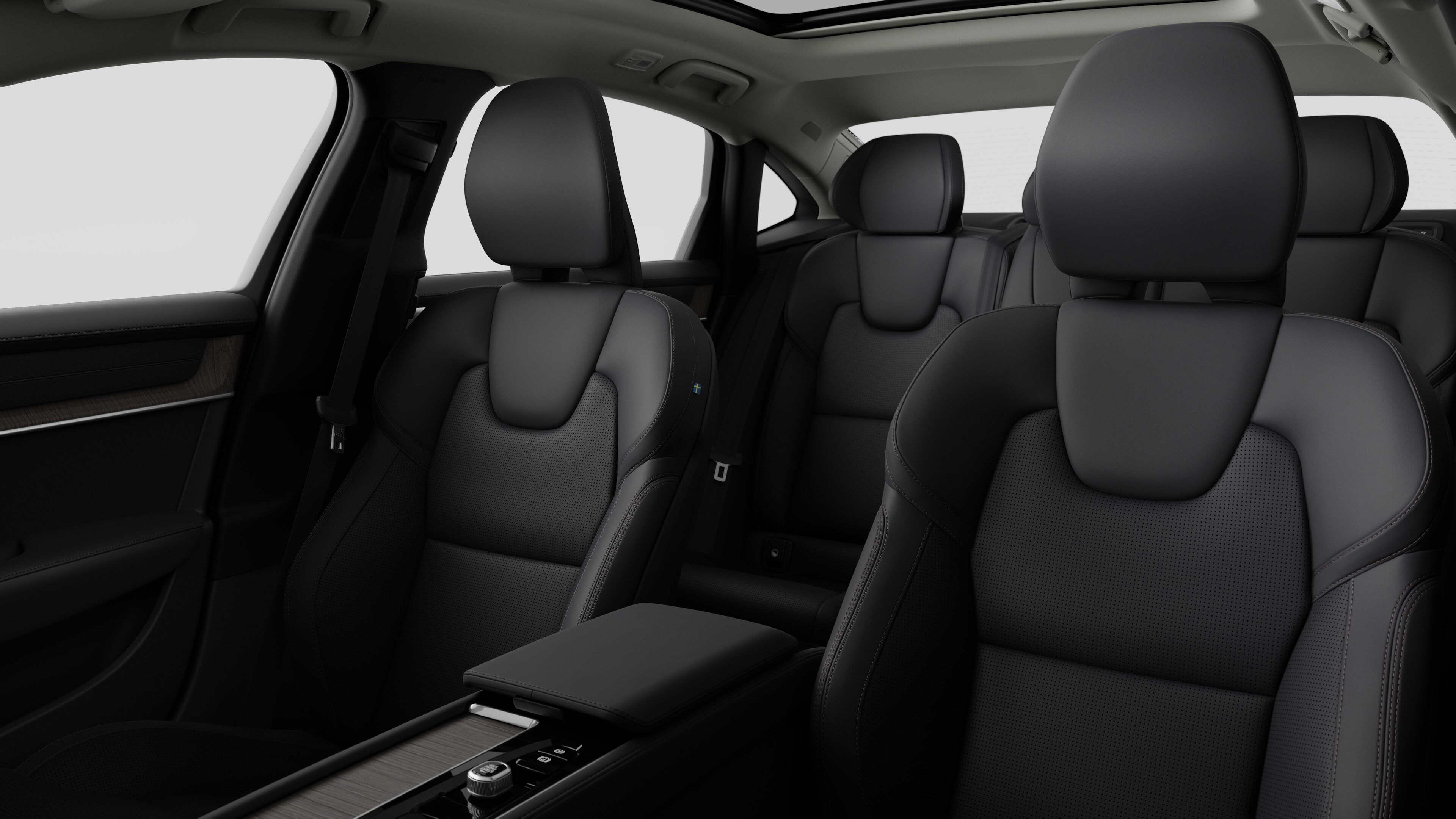 Volvo car interior showing rear passenger seats and center console in plain studio background.