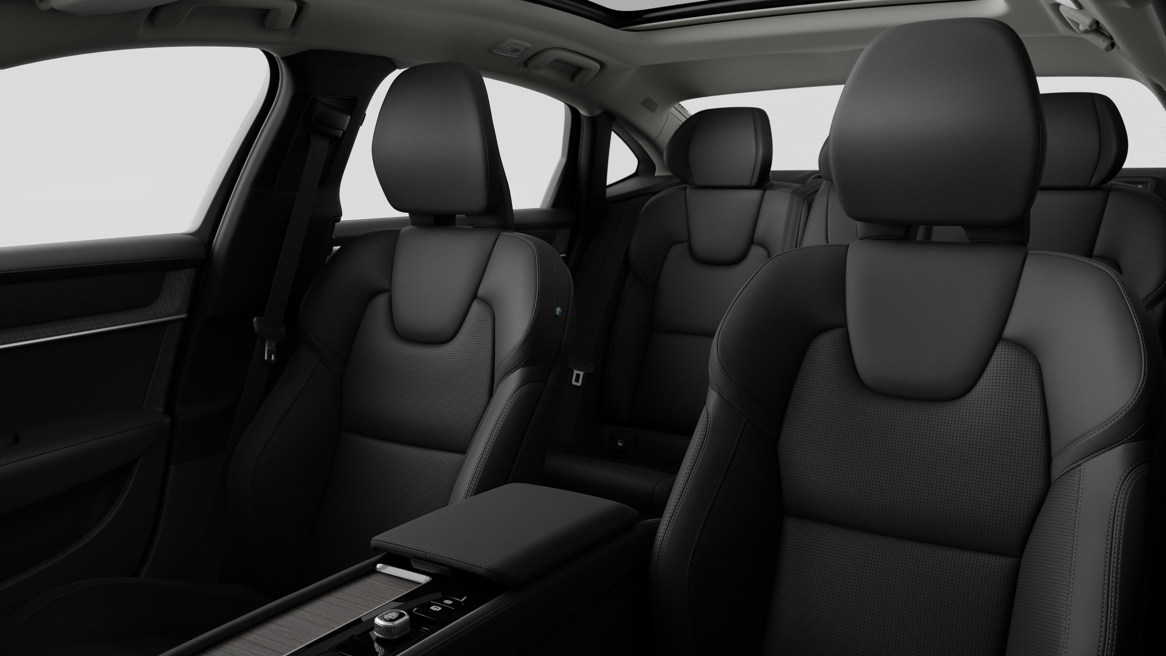 Volvo car interior showing rear passenger seats and center console in plain studio background.