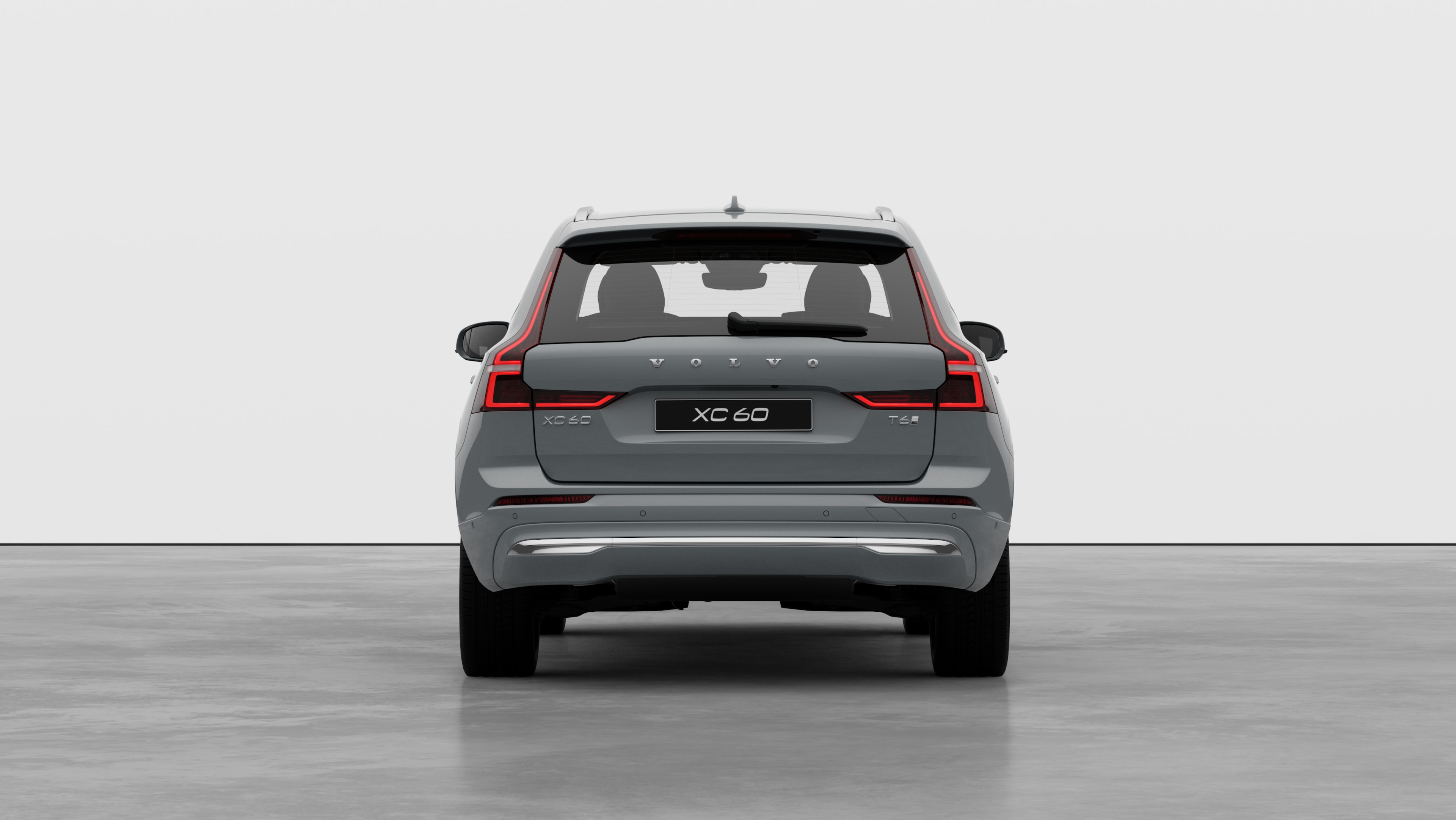 Widok samochodu Volvo z tyłu na tle zwykłego studia