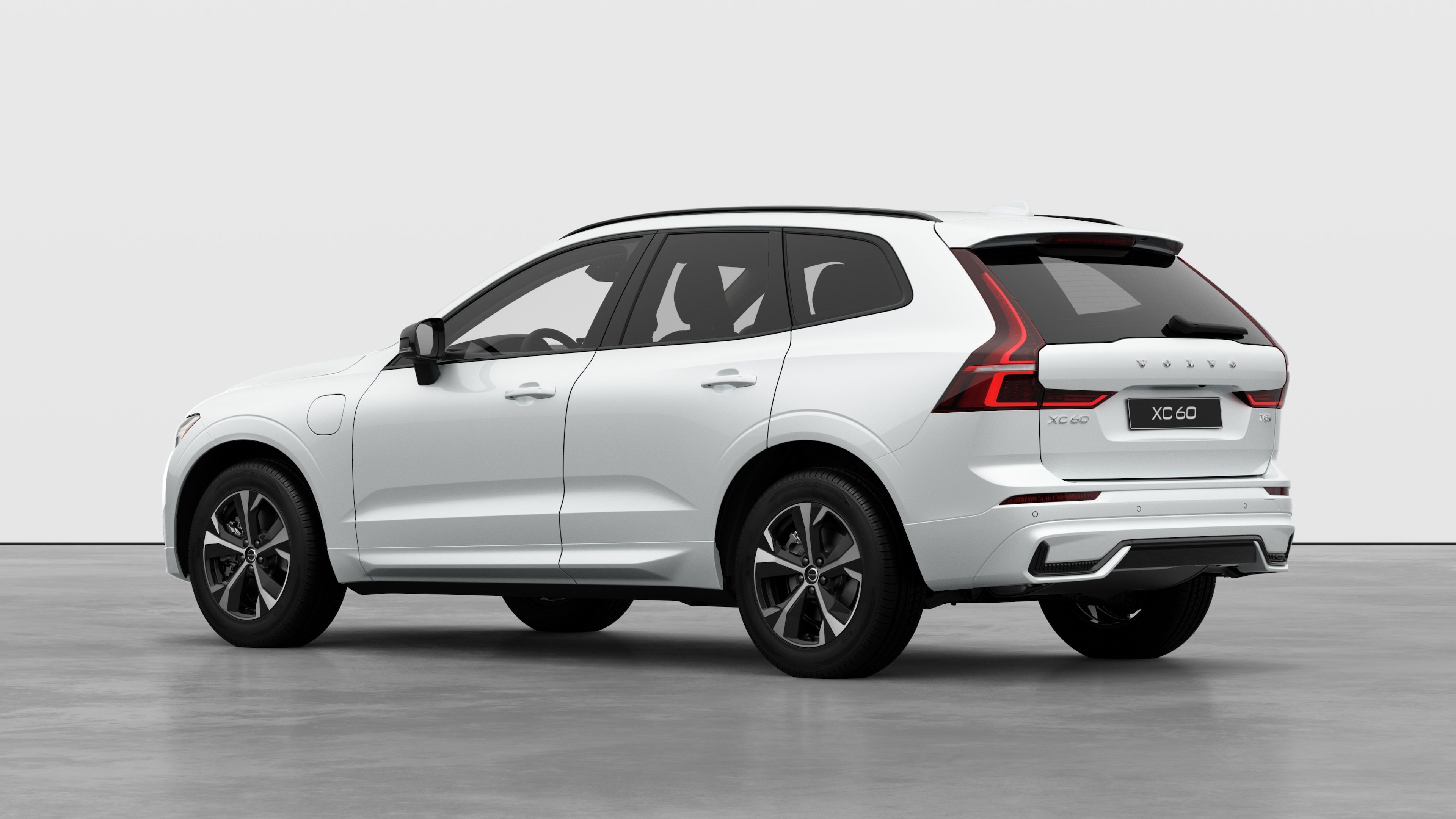 Volvo car rear three-quarter view in a plain studio background.