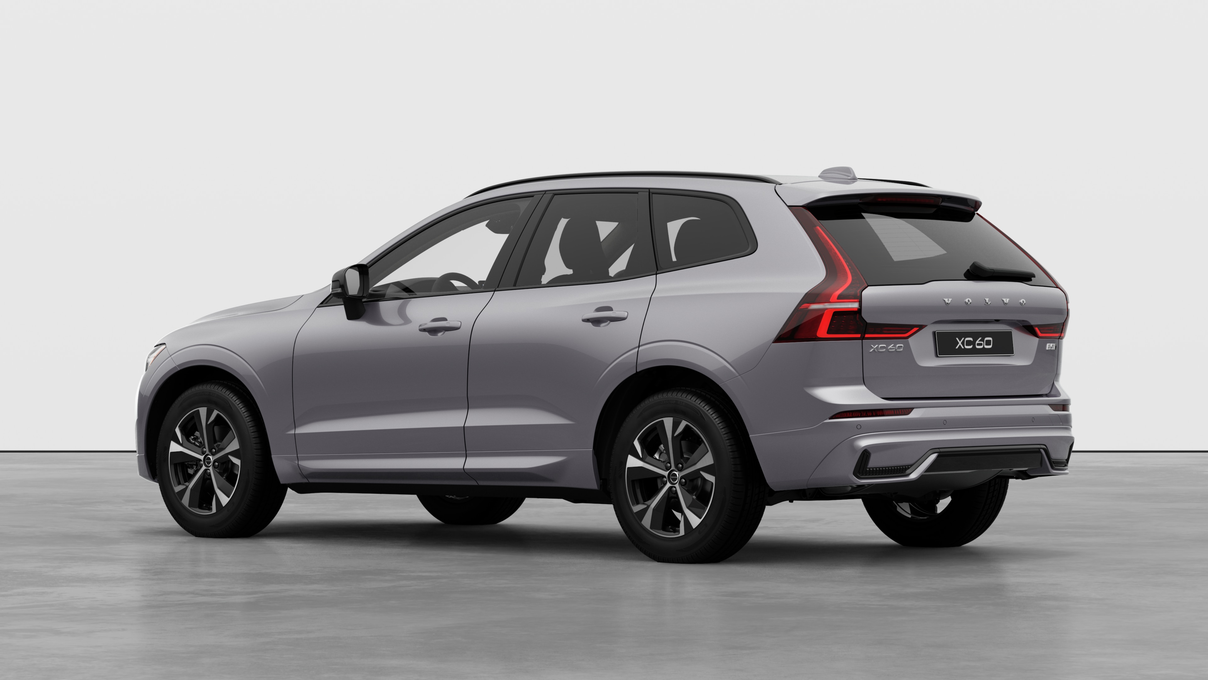 Volvo car rear three-quarter view in a plain studio background.