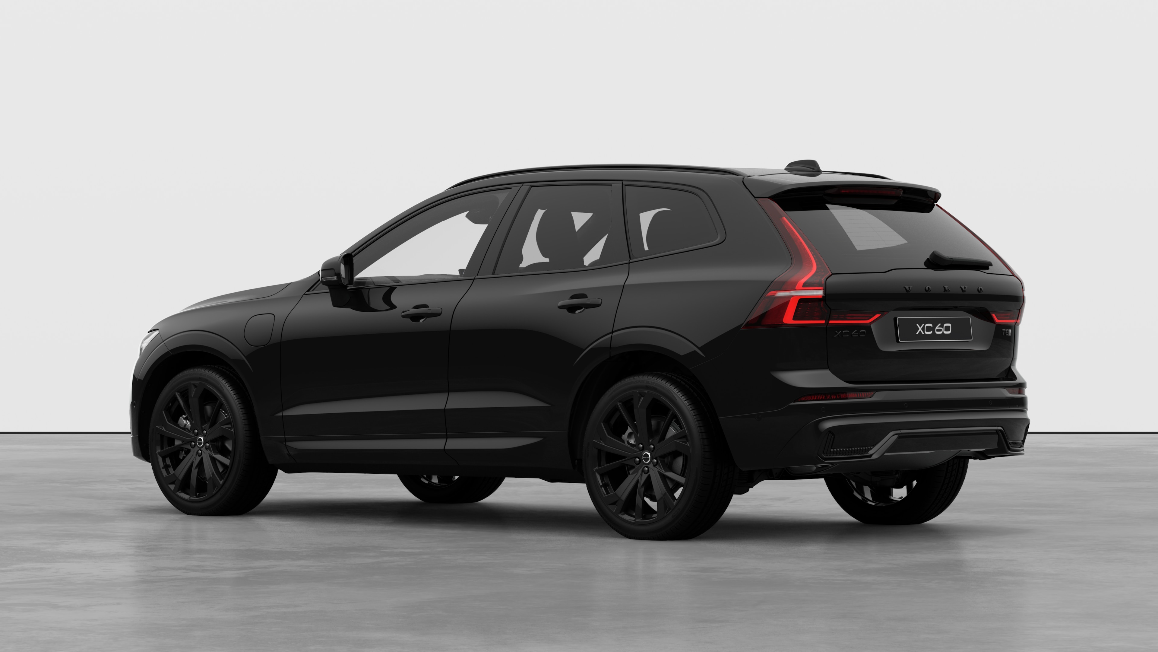 Volvo car rear three-quarter view in a plain studio background.