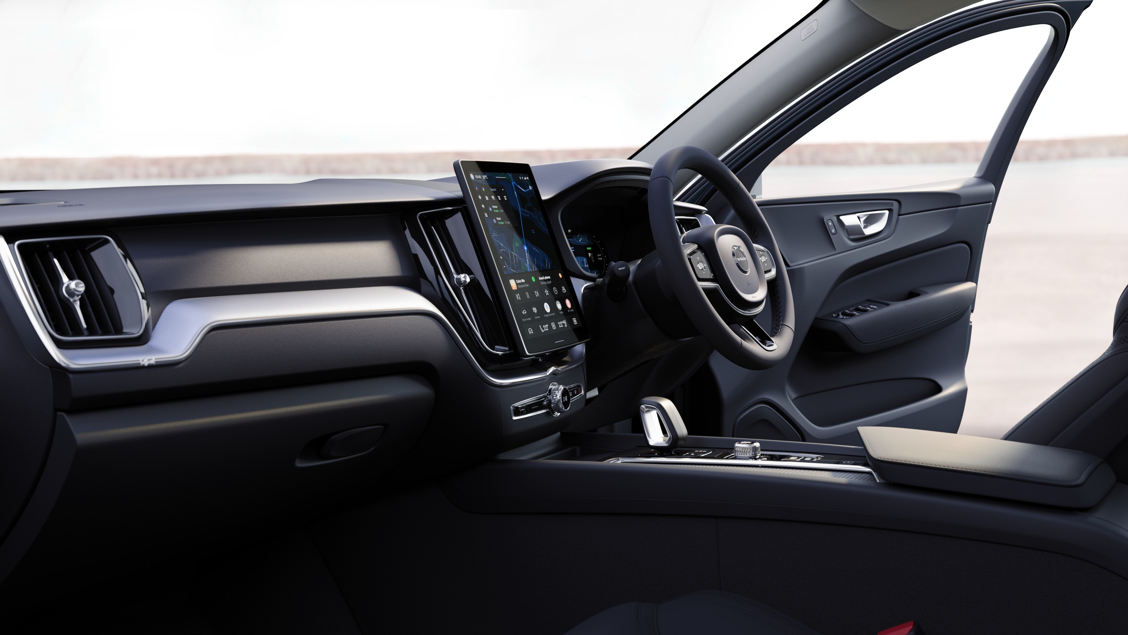Volvo car interior showing dashboard, steering wheel, and centre console with digital display in an open road background.