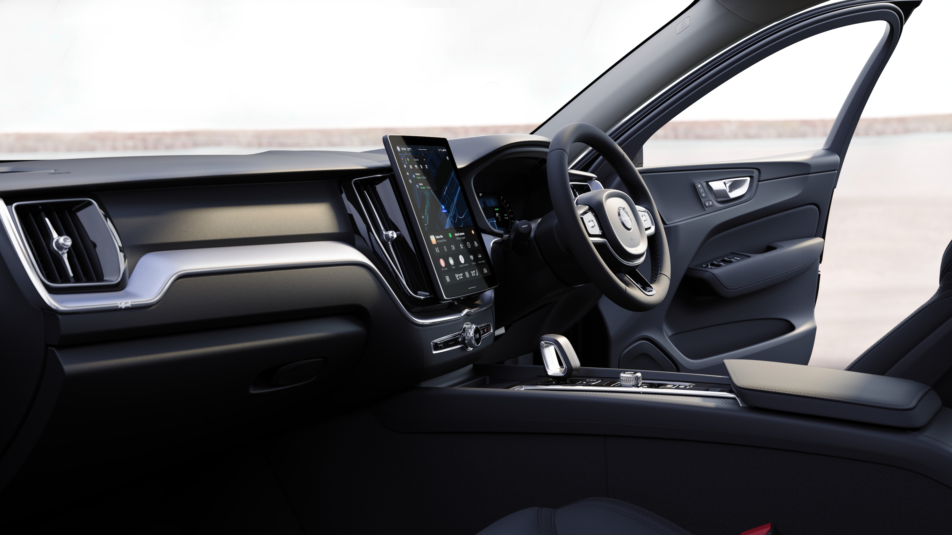 Volvo car interior showing dashboard, steering wheel, and center console with digital display in an open road background.