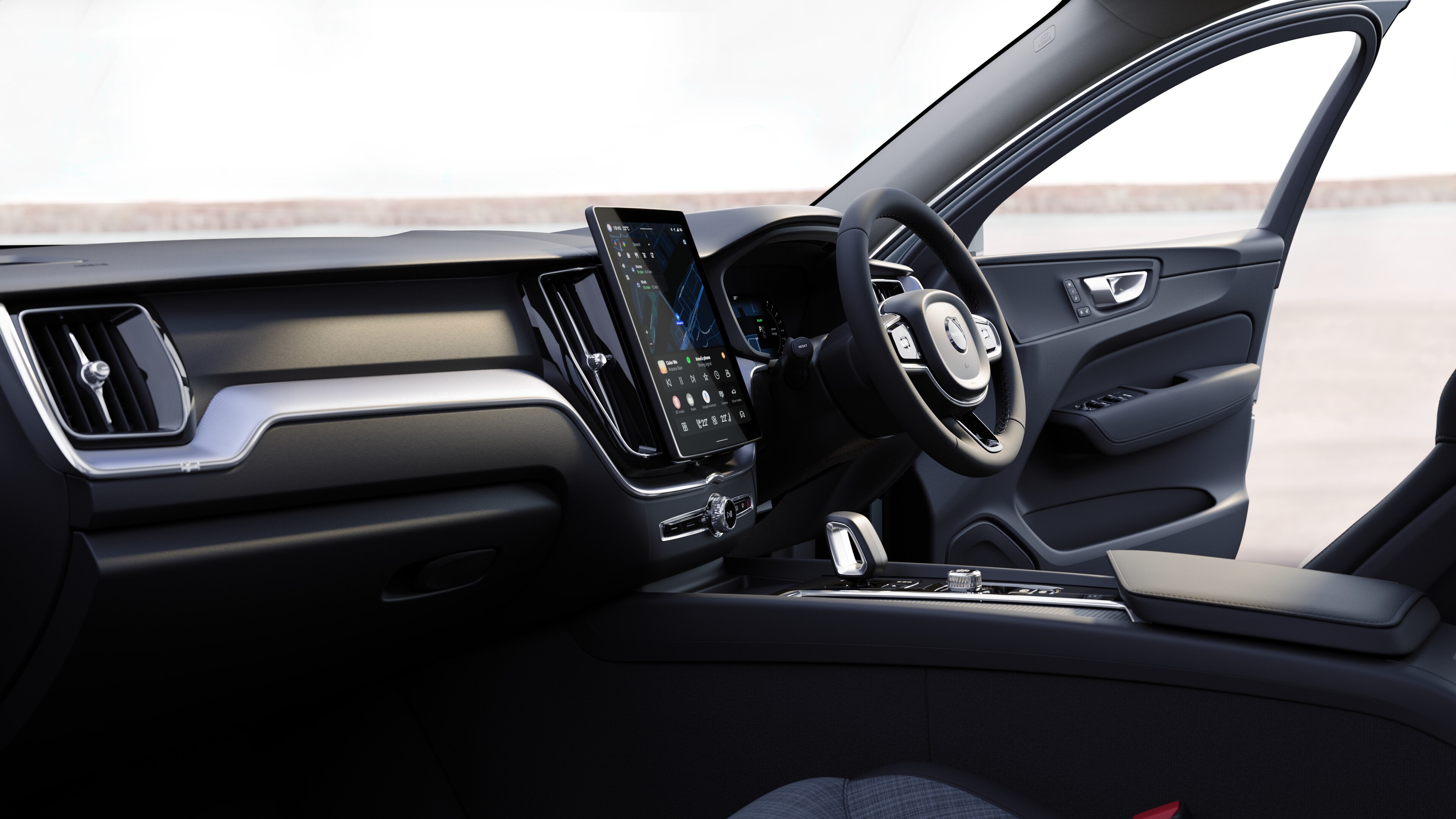 Volvo car interior showing dashboard, steering wheel, and center console with digital display in an open road background.