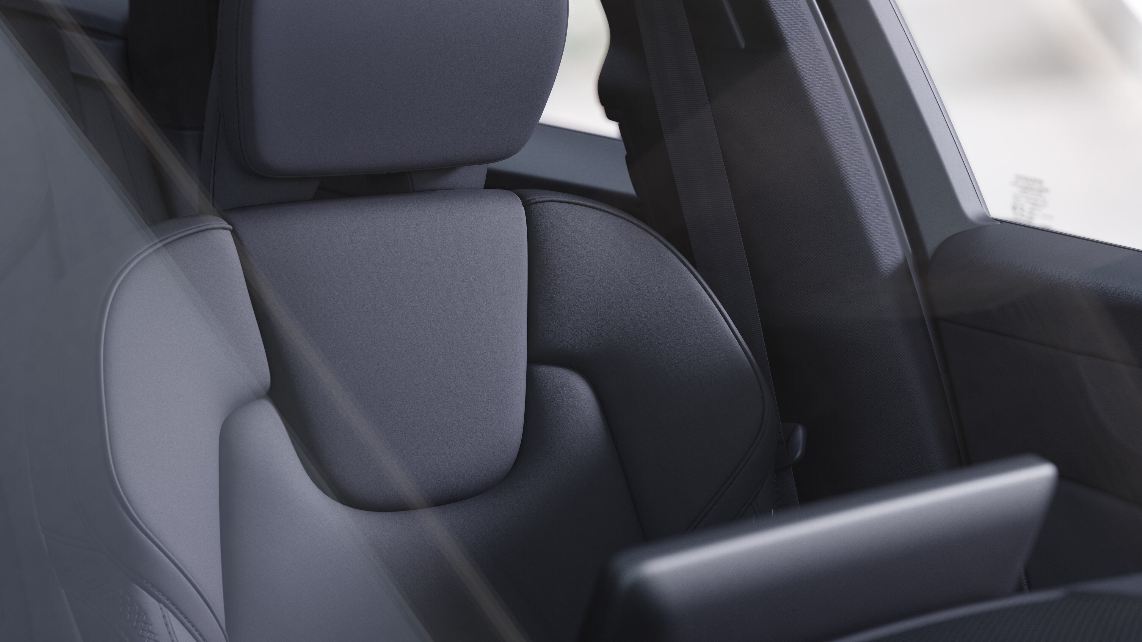 Volvo car interior showing front and rear passenger seats, steering wheel, dashboard, and center console against a plain studio background.