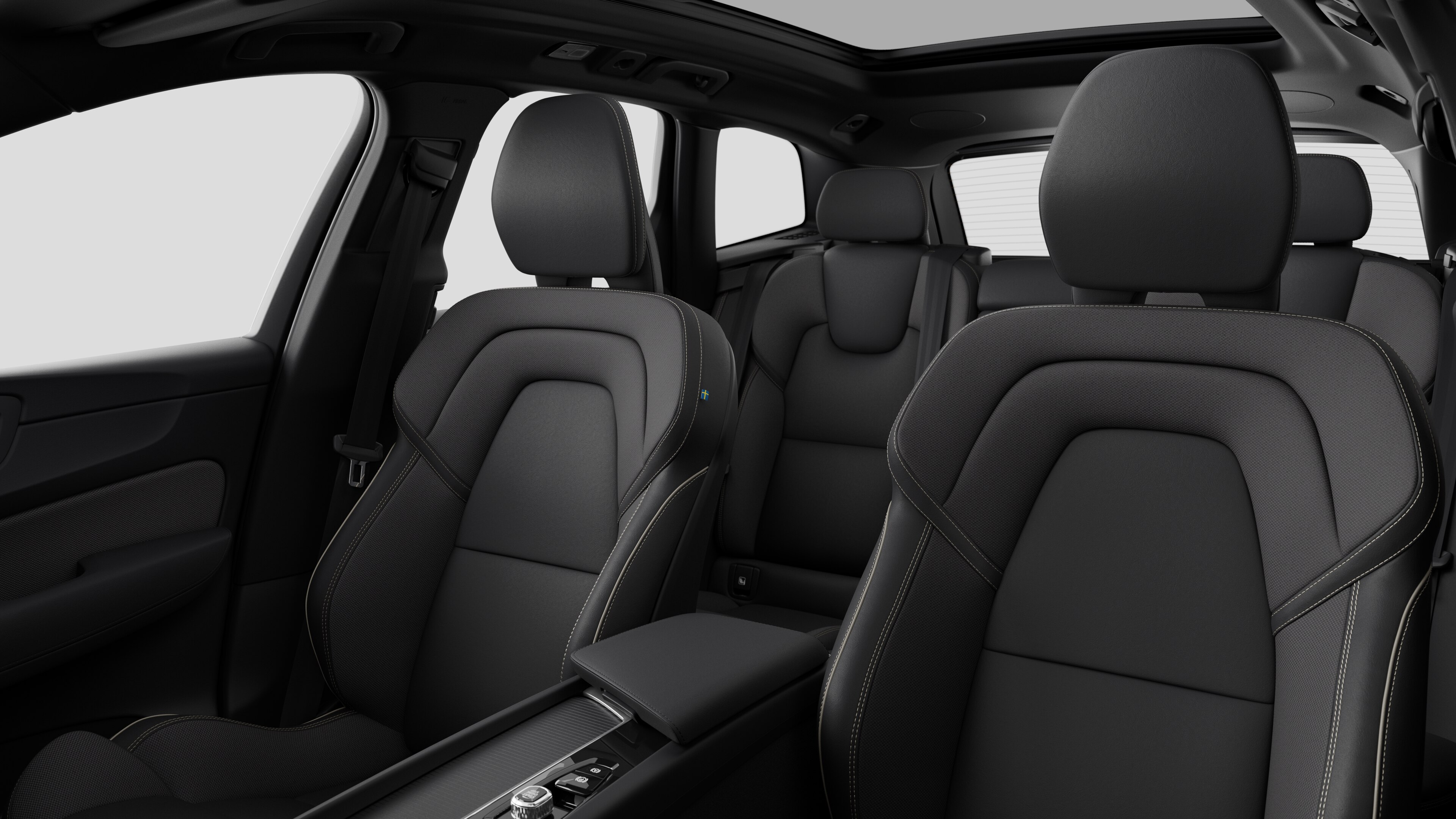 Volvo car interior showing rear passenger seats and center console in plain studio background.
