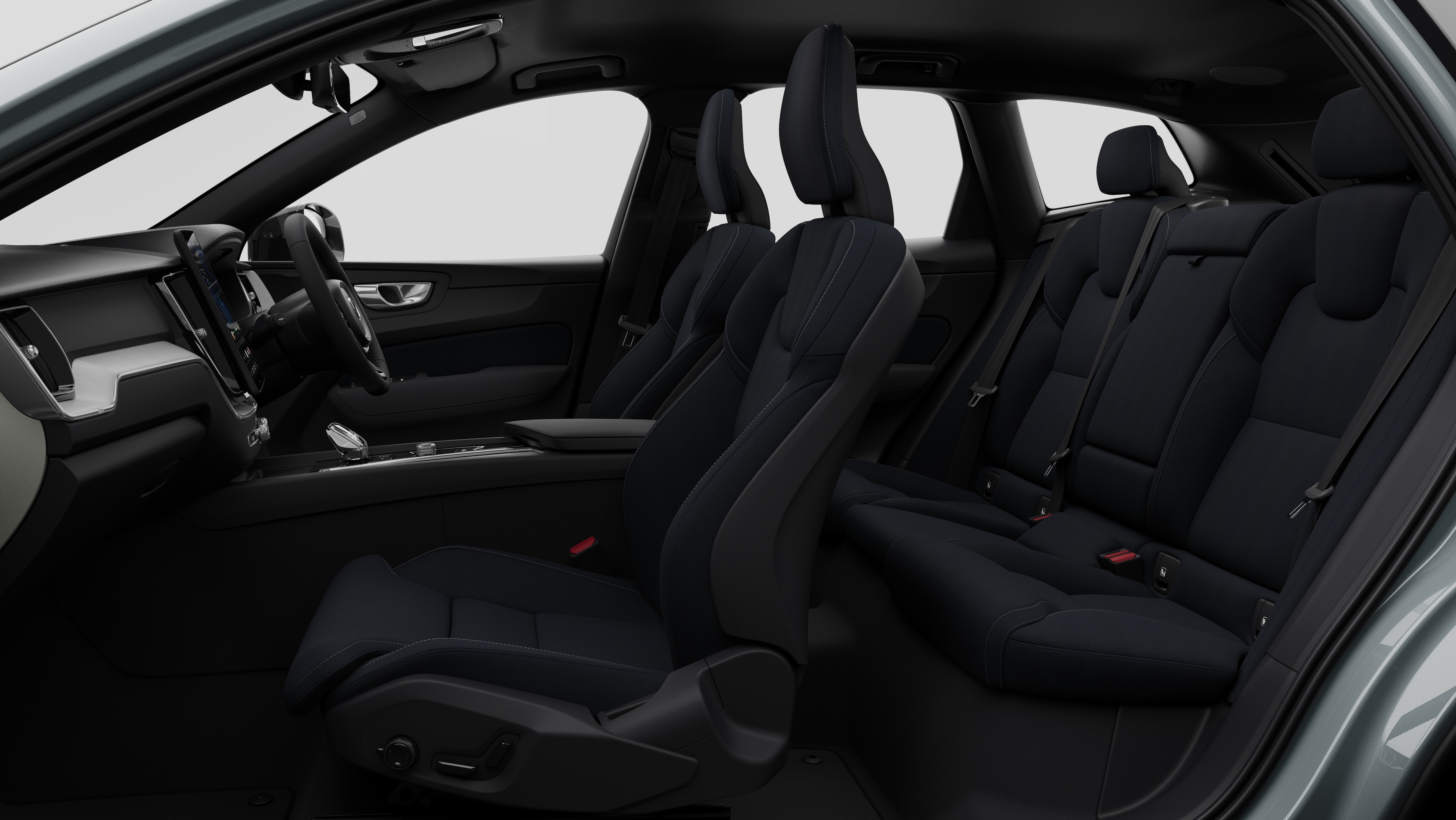 Volvo car interior side view showcasing front seats, rear passenger seats, steering wheel, dashboard, and center console, set against plain studio background.