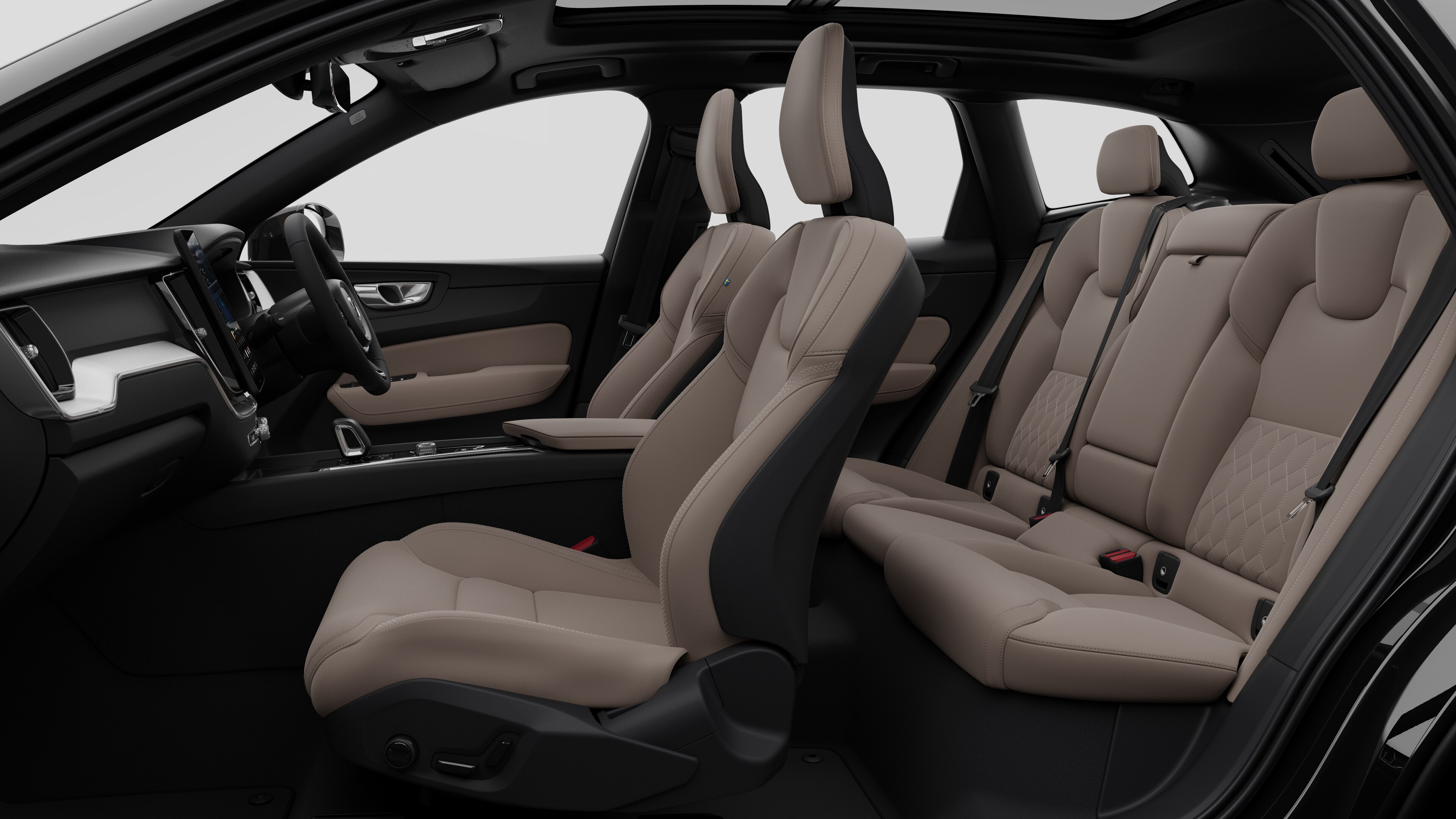 Volvo car interior side view showcasing front seats, rear passenger seats, steering wheel, dashboard, and center console, set against plain studio background.