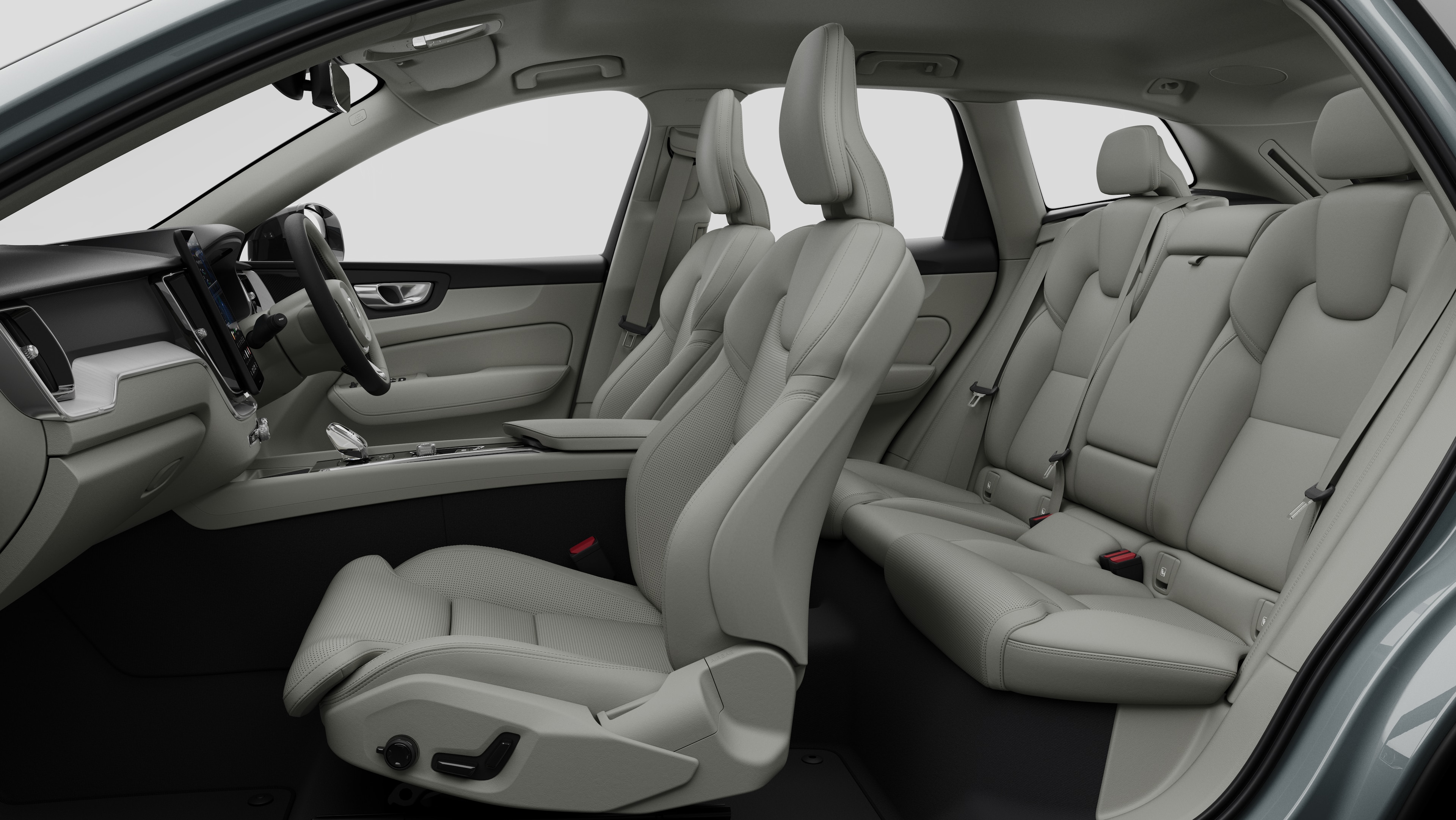 Volvo car interior side view showcasing front seats, rear passenger seats, steering wheel, dashboard, and center console, set against plain studio background.