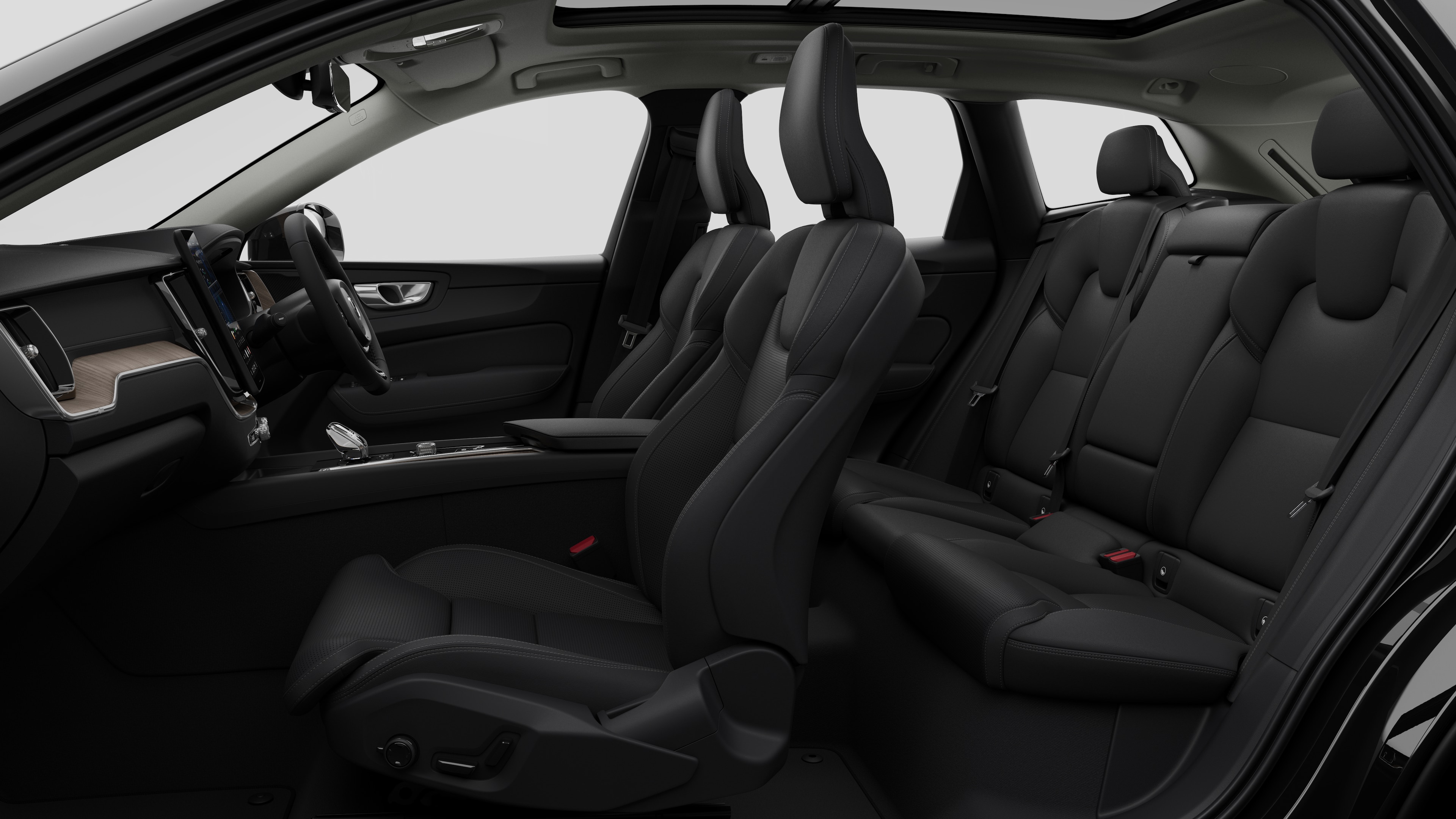 Volvo car interior side view showcasing front seats, rear passenger seats, steering wheel, dashboard, and center console, set against plain studio background.