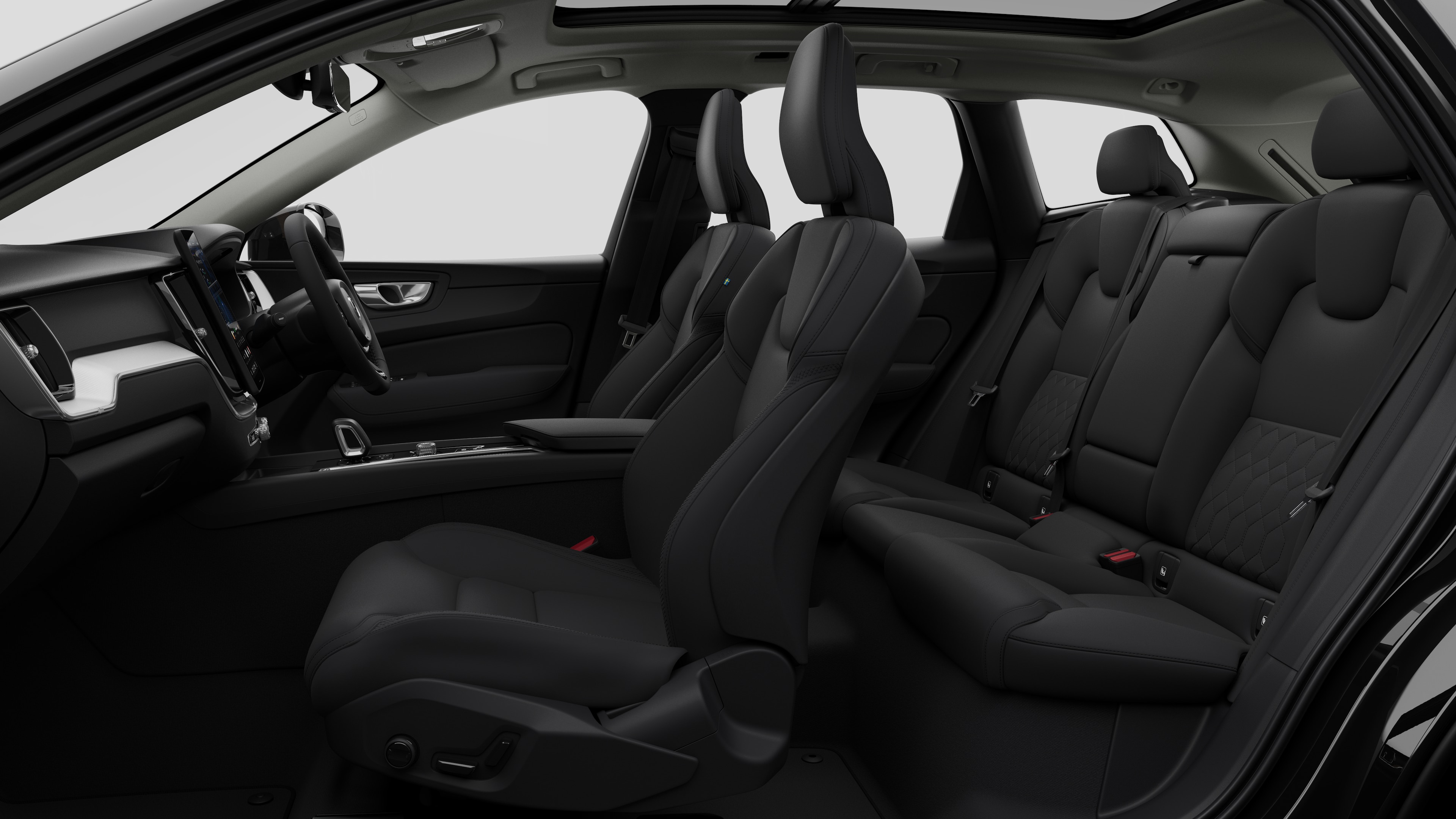 Volvo car interior side view showcasing front seats, rear passenger seats, steering wheel, dashboard, and center console, set against plain studio background.