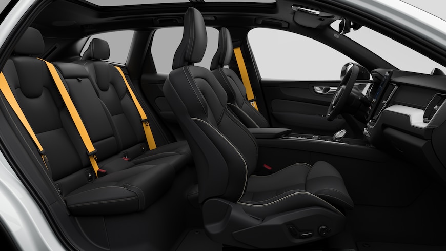 Volvo car interior side view showcasing front seats, rear passenger seats, steering wheel, dashboard, and center console, set against plain studio background.