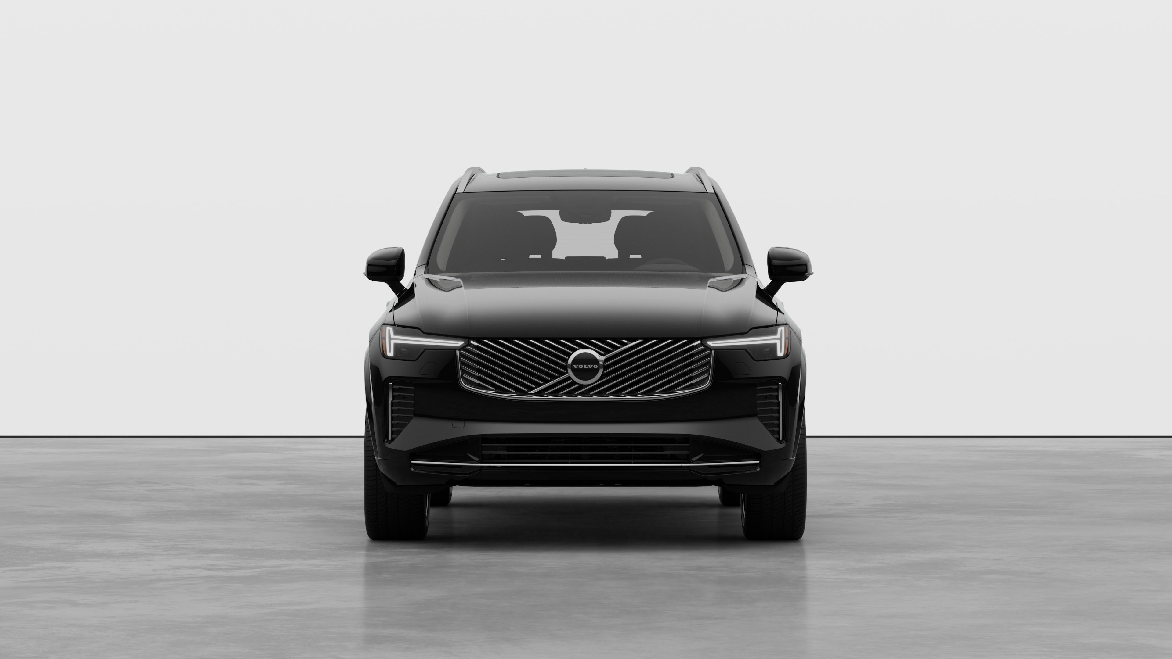 Front view of a Volvo car in a plain studio background.