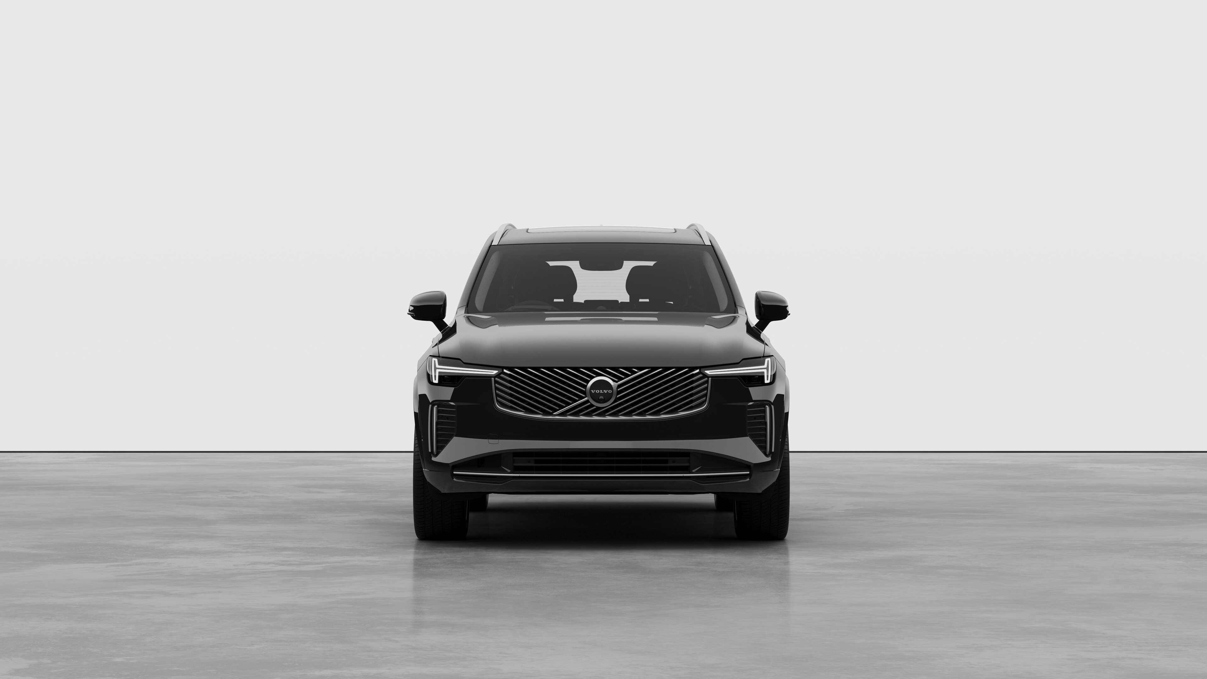 Front view of a Volvo car in a plain studio background.