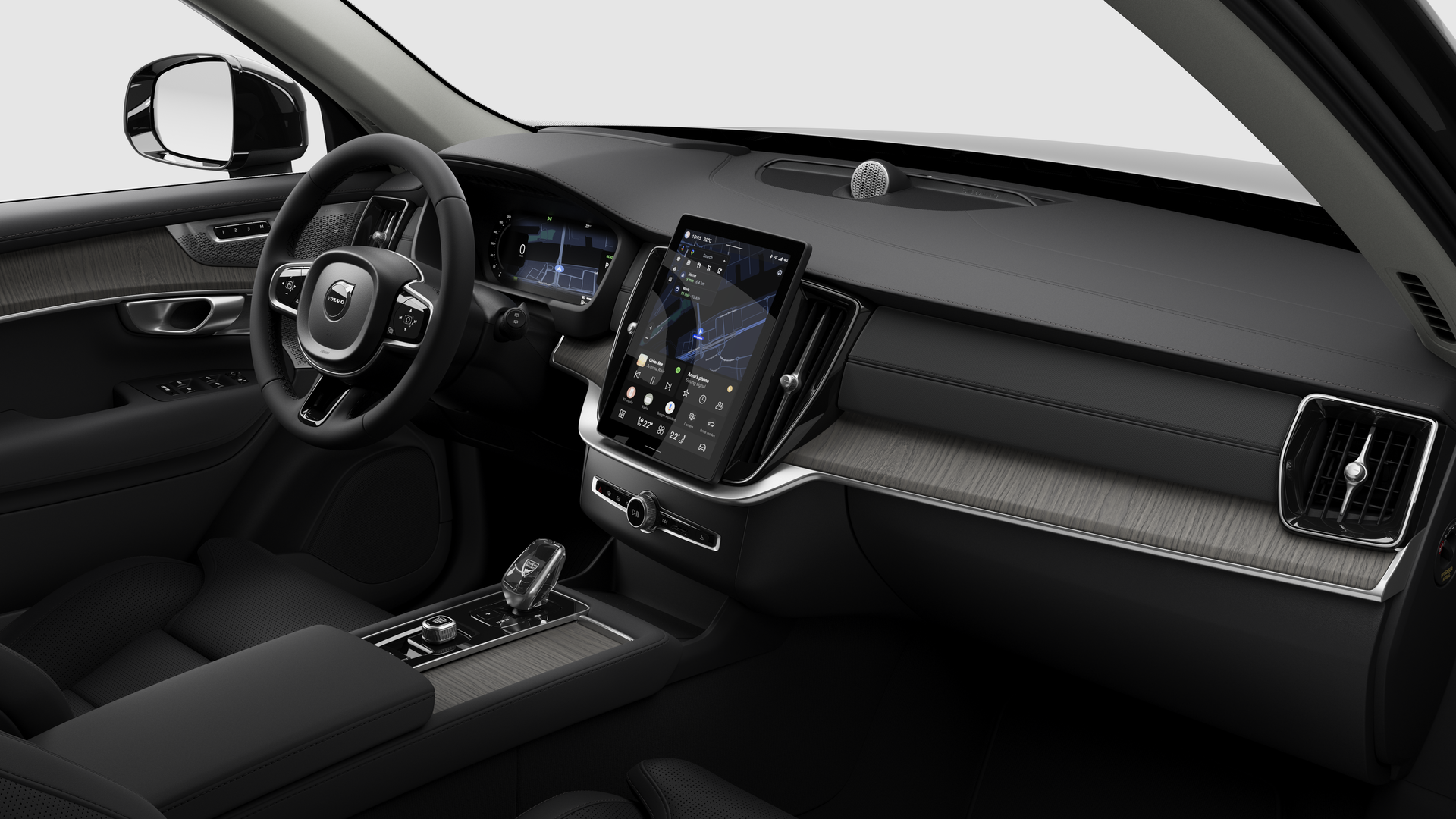 Hình ảnh nội thất của xe Volvo hiển thị bảng điều khiển, vô lăng, bảng điều khiển trung tâm và màn hình hiển thị kỹ thuật số trong nền studio đơn giản.