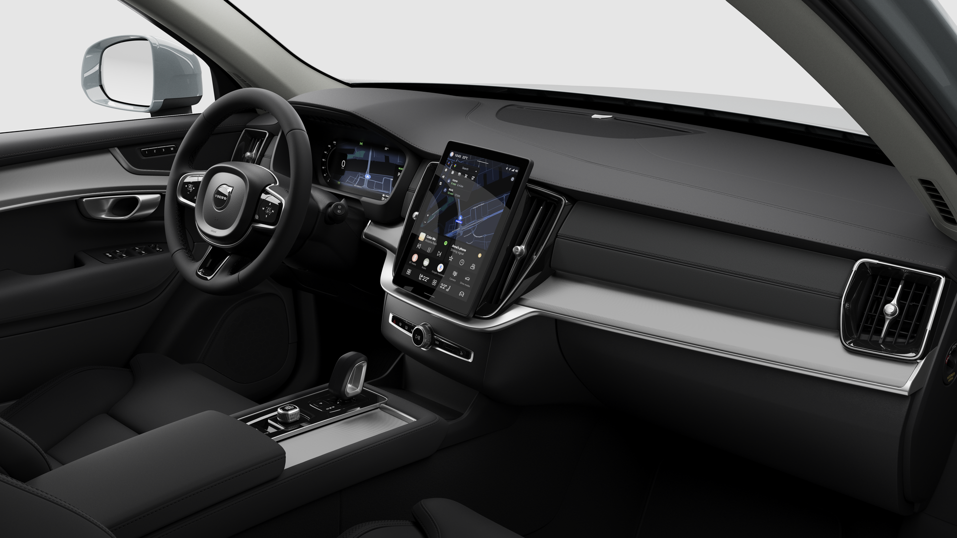 Vue intérieure d’une Volvo montrant le tableau de bord, le volant, la console centrale et l’écran d’affichage numérique sur un fond de studio uni.