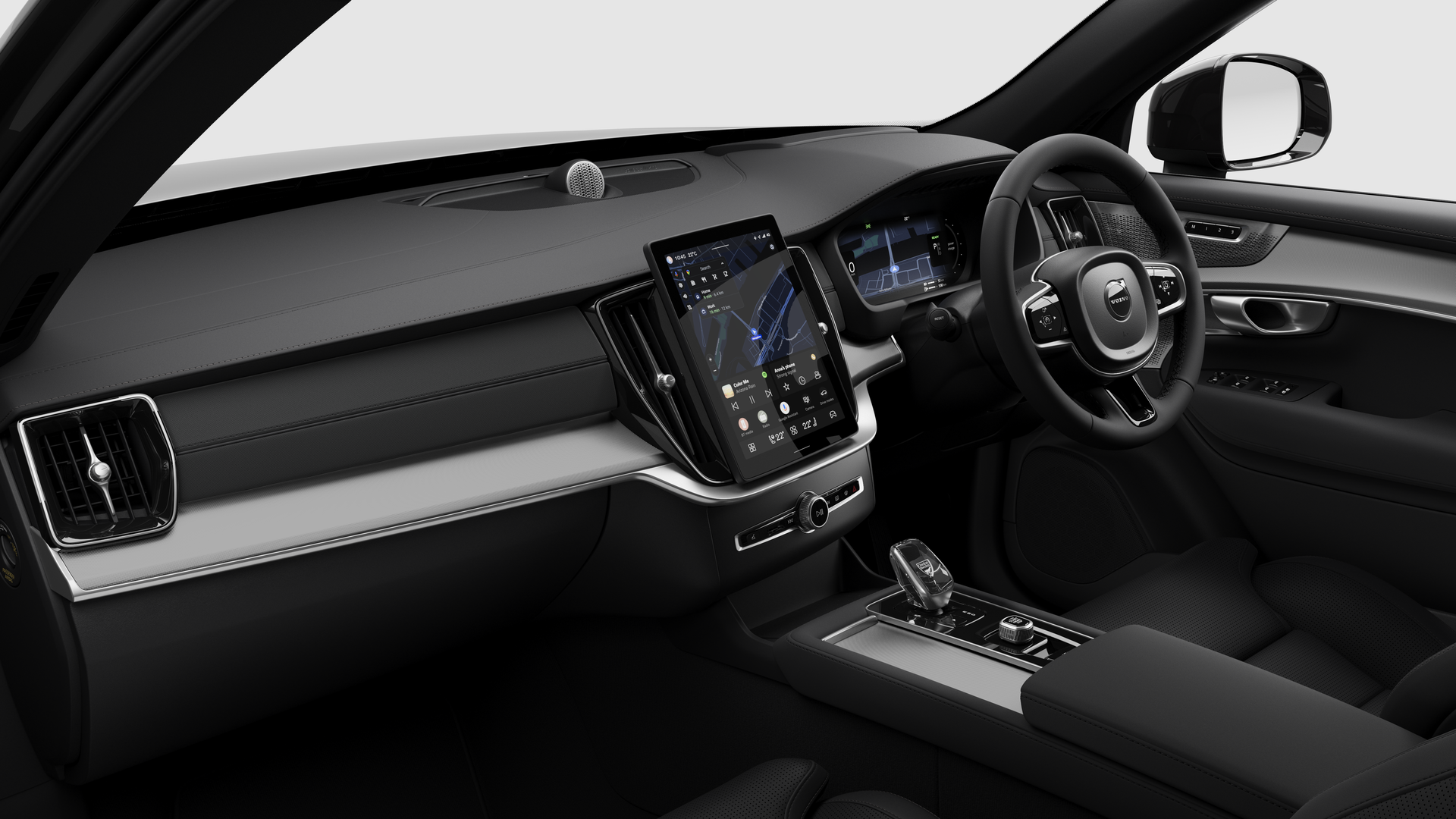 Interior view of a Volvo car showing the dashboard, steering wheel, center console, and digital display screen in a plain studio background.
