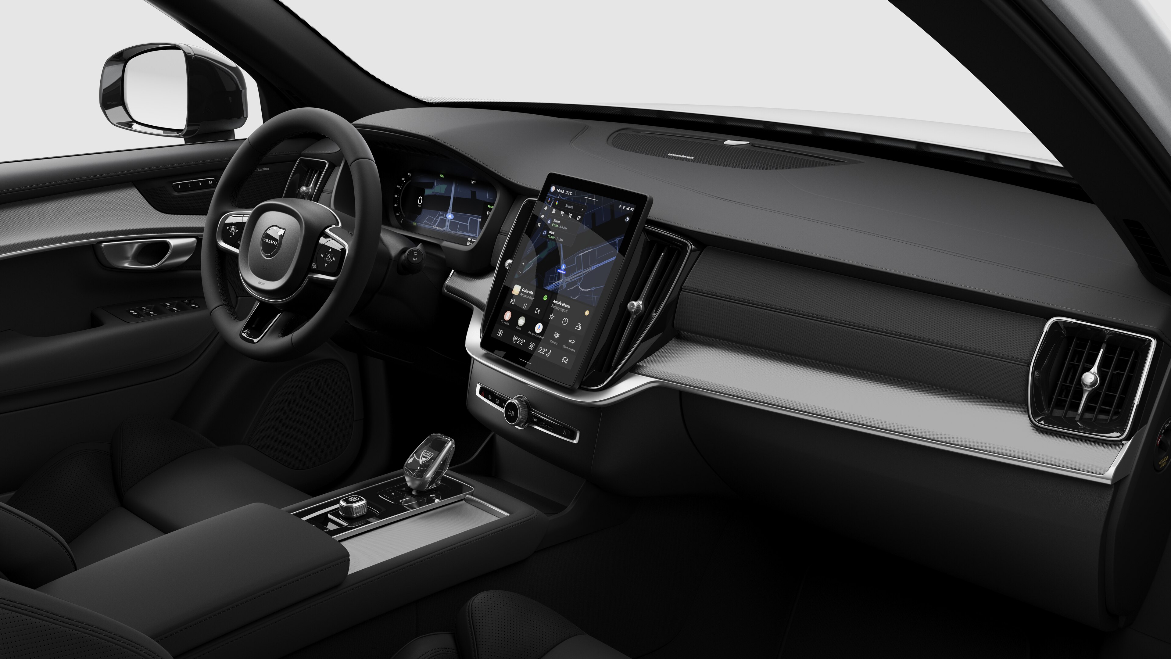 Wnętrze samochodu Volvo z deską rozdzielczą, kierownicą, konsolą środkową i cyfrowym wyświetlaczem na prostym tle studia